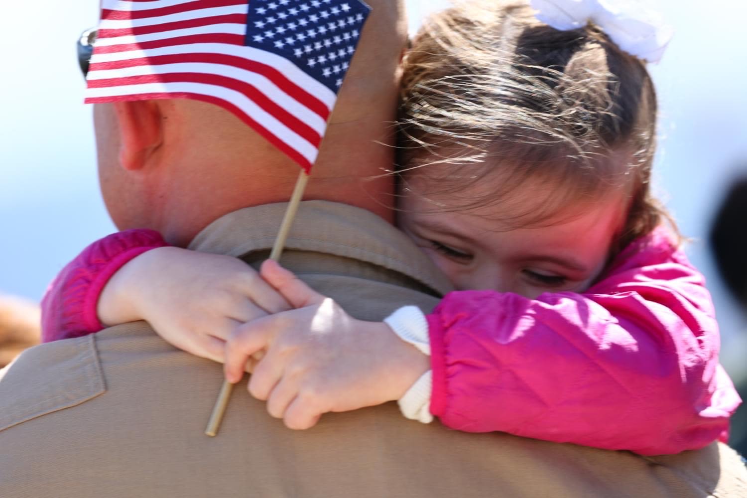 Child holds american flag
