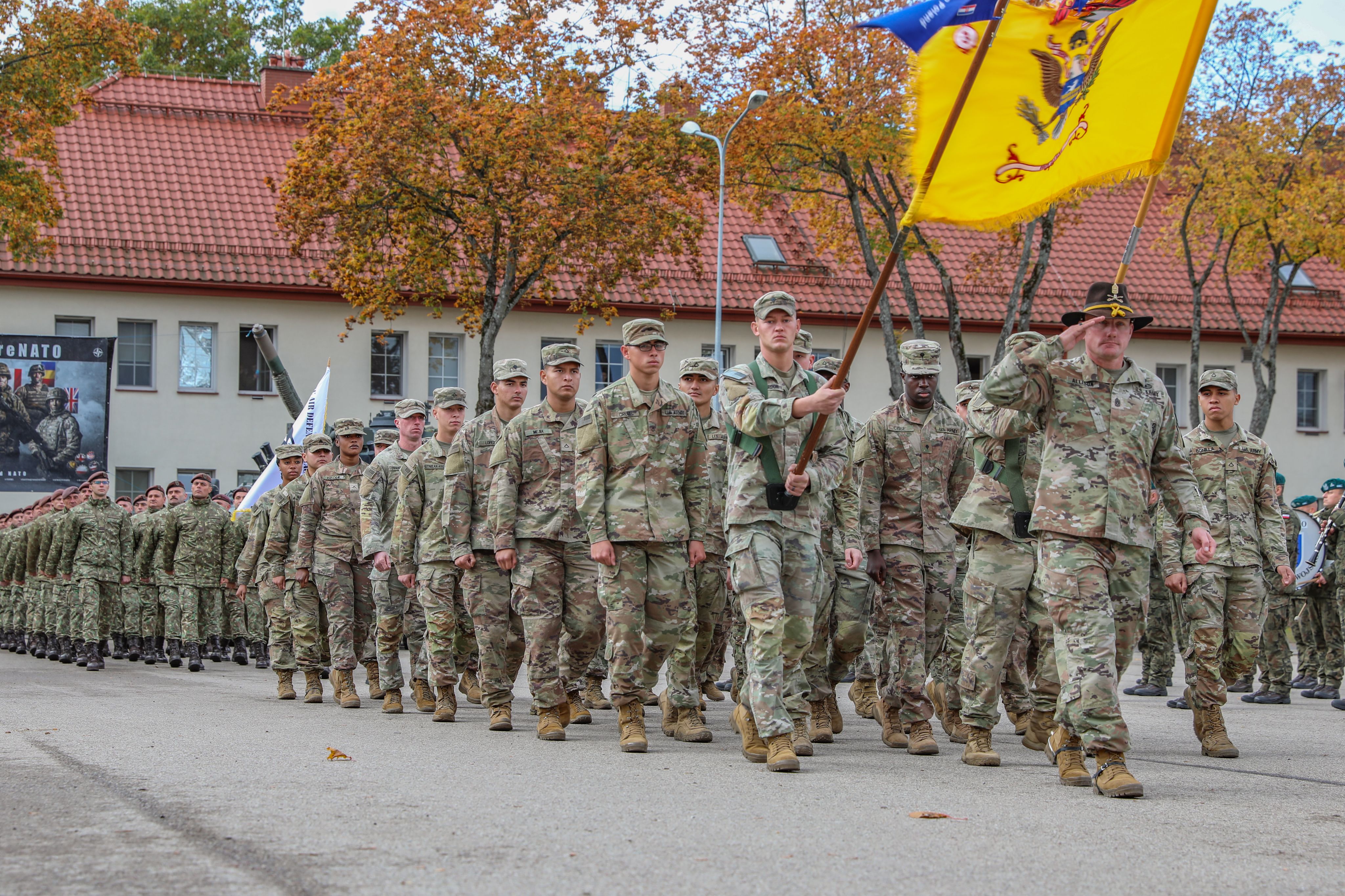 Soldiers march in formation.