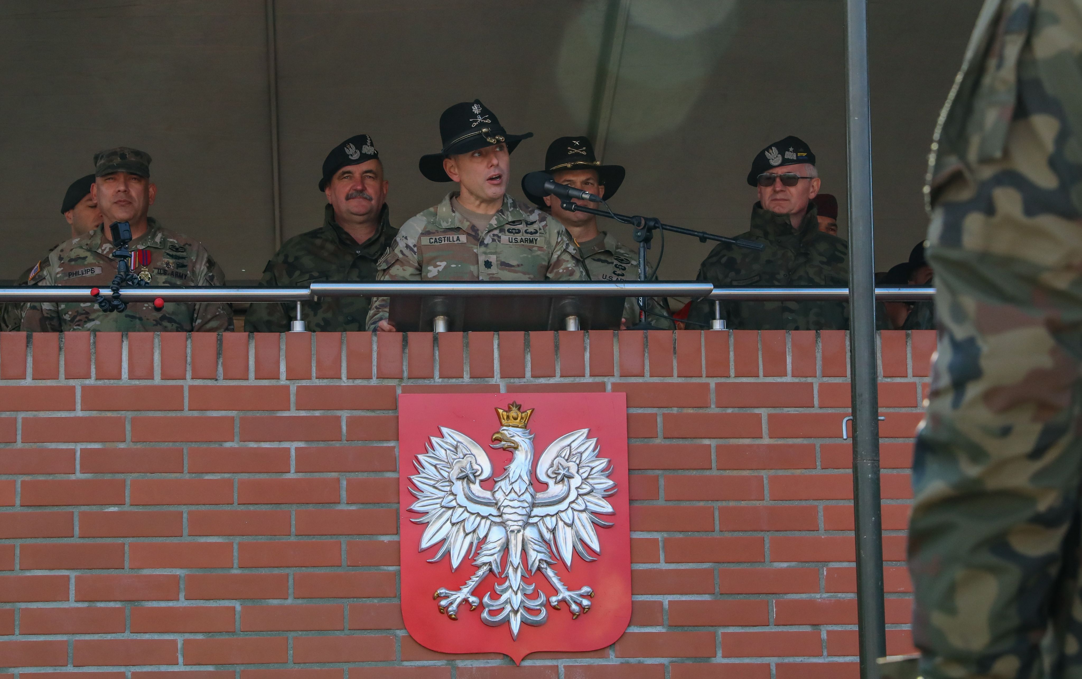 Soldier speaks at podium.