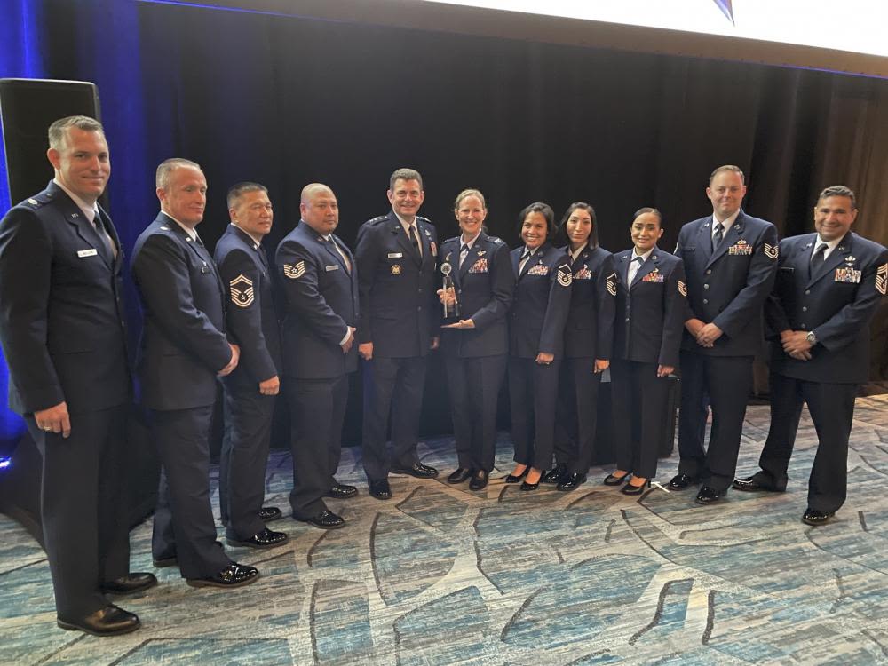 Members from the California Air National Guard’s 146th Airlift Wing accept award