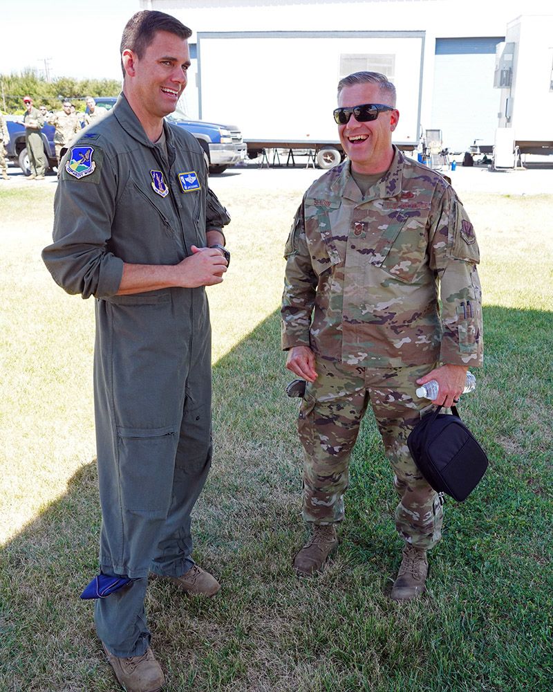 Two Airmen talk.