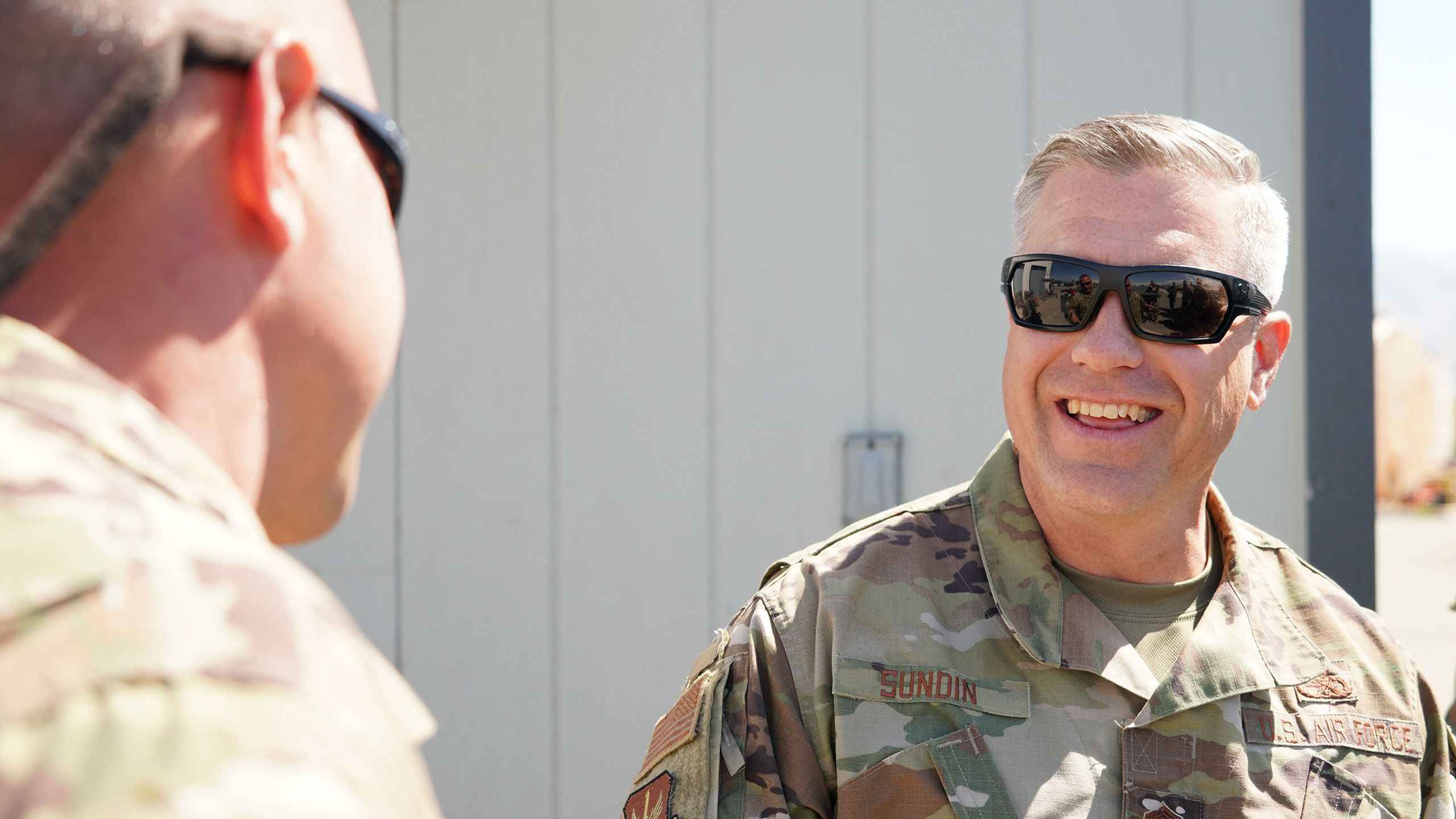 Airman smiles in uniform.