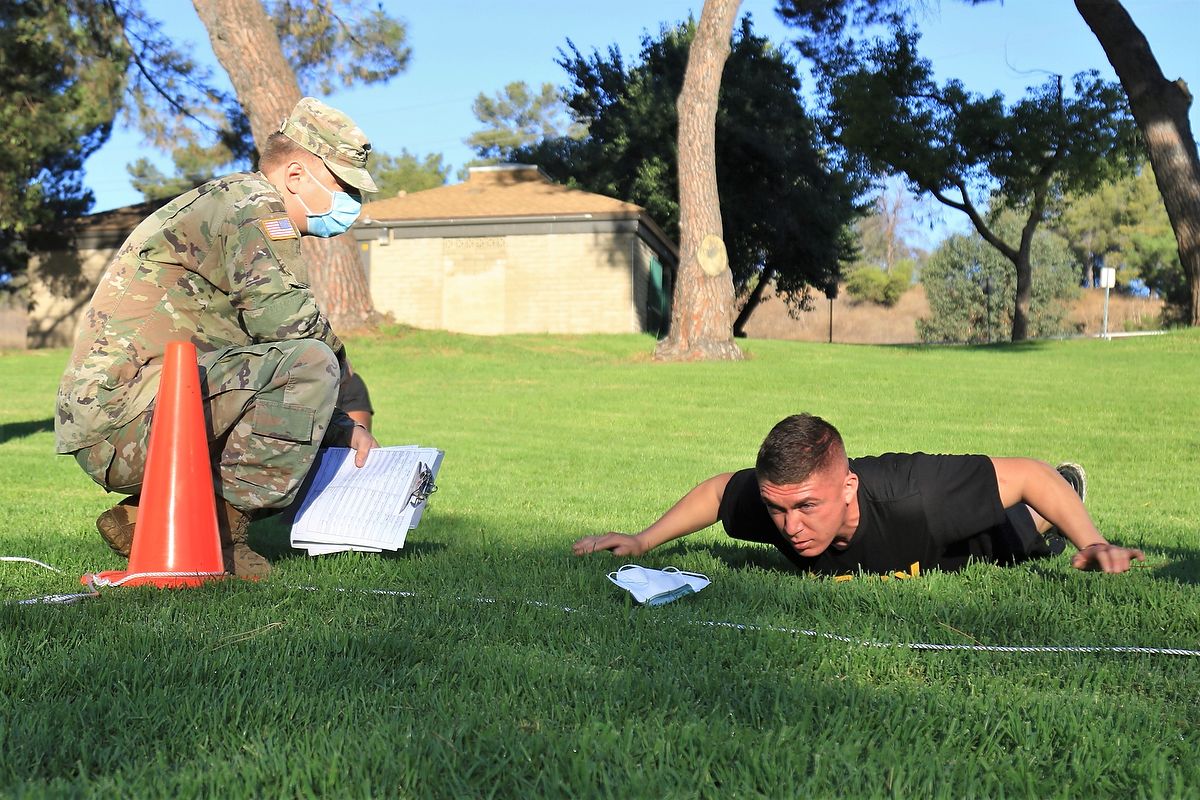 Soldier does hand release push up.