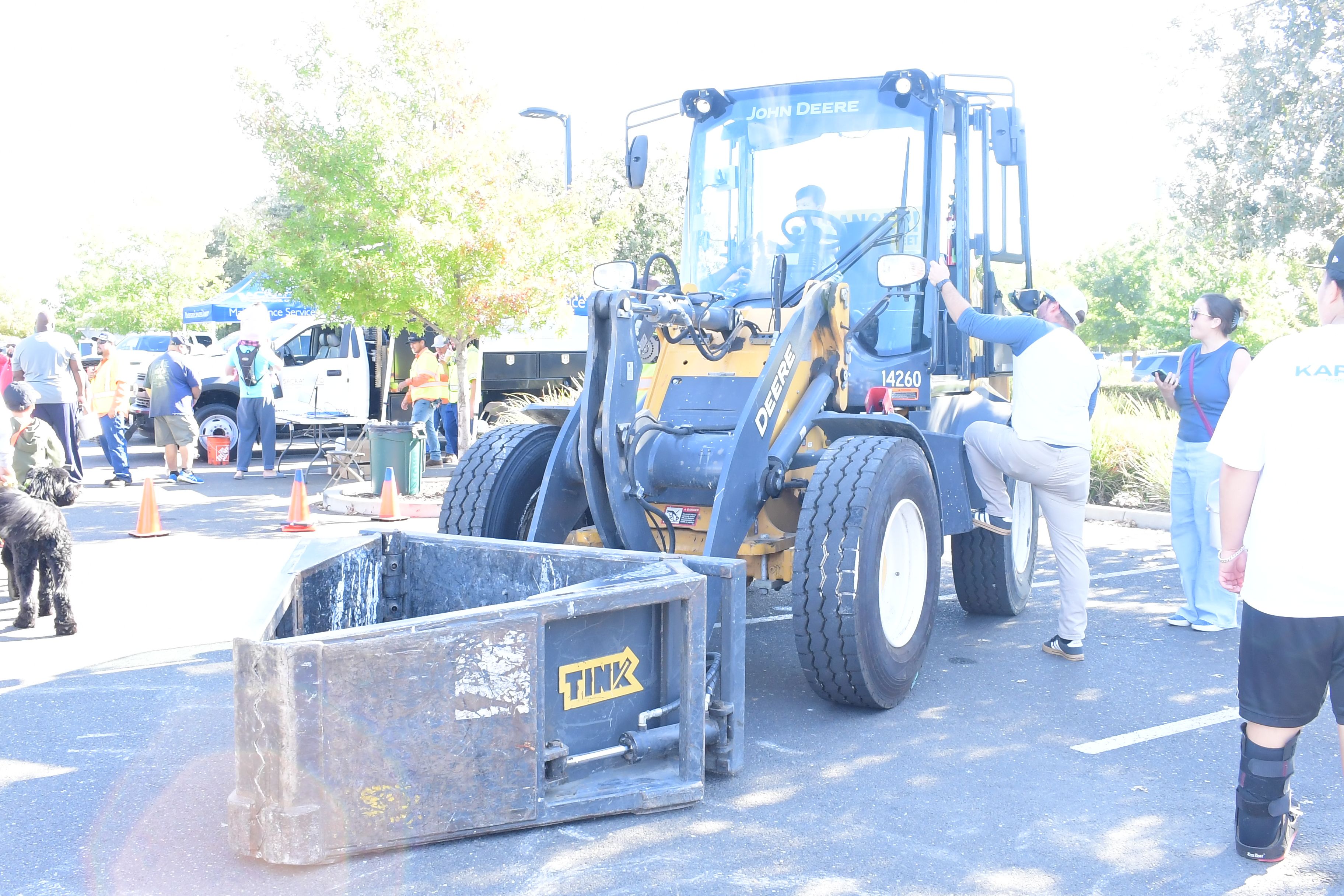 Child and parents stand by deris removal vehicle