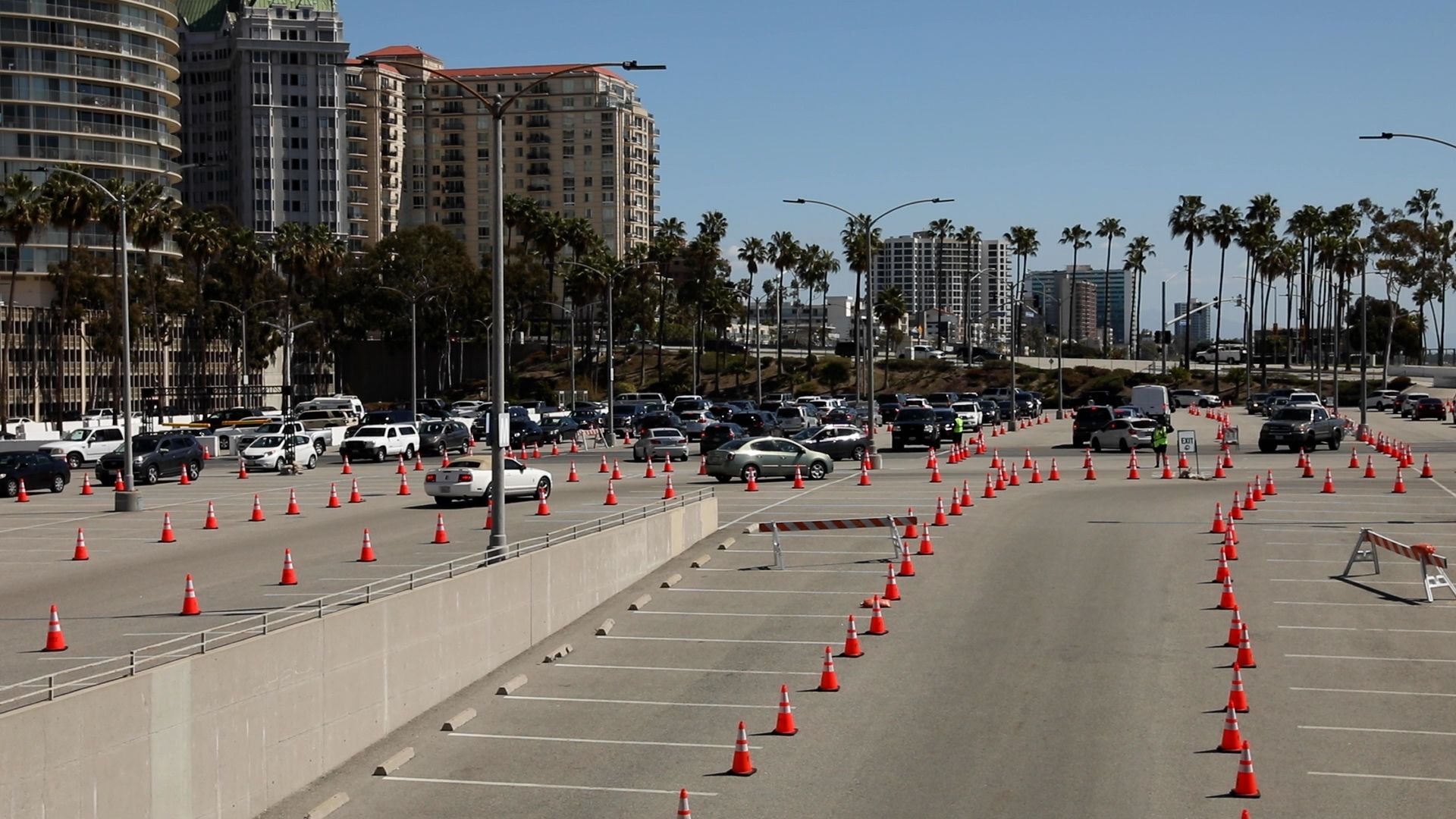 Long Beach residents exit the drive-thru vaccination lanes Long Beach Entertainment and Convention Center after receiving their COVID-19 vaccination, March 16,2021.
