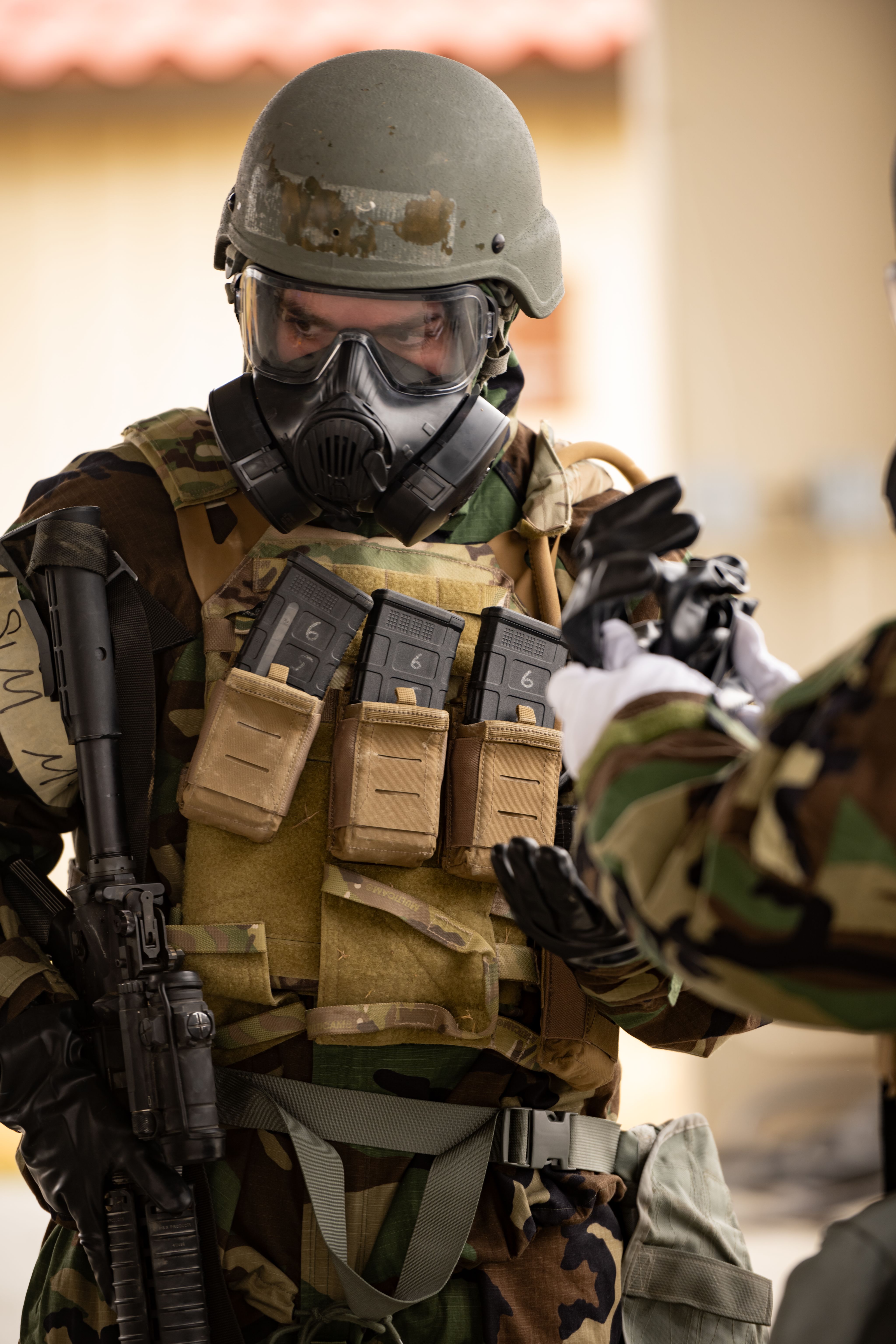 Airman wearing gasmask