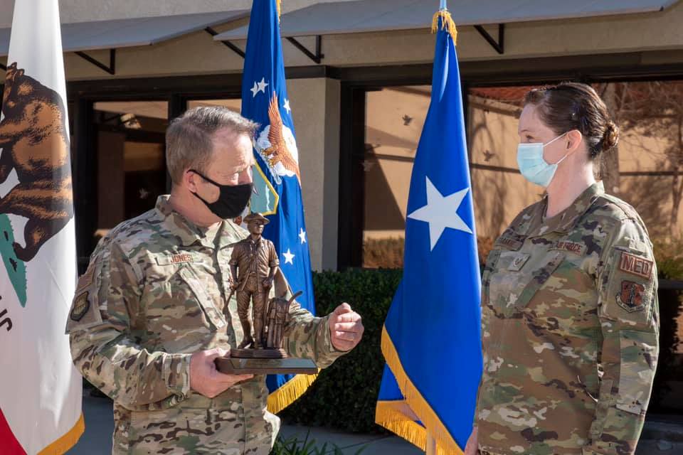 General presents trophy.