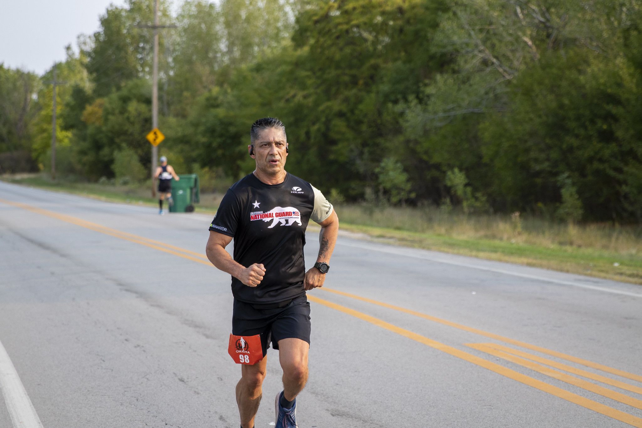 Marathon runner on road.