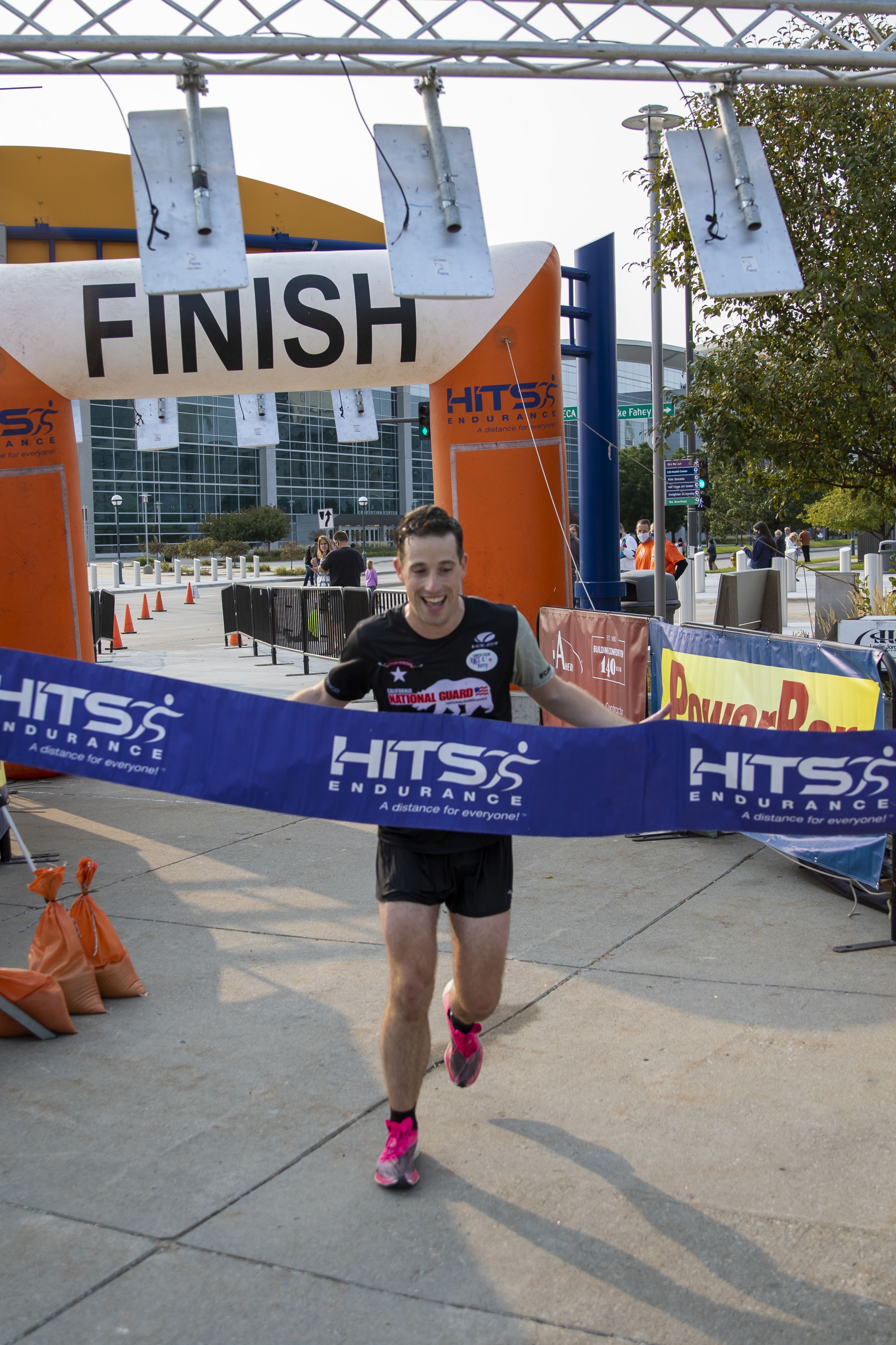 Runner crosses finish line.