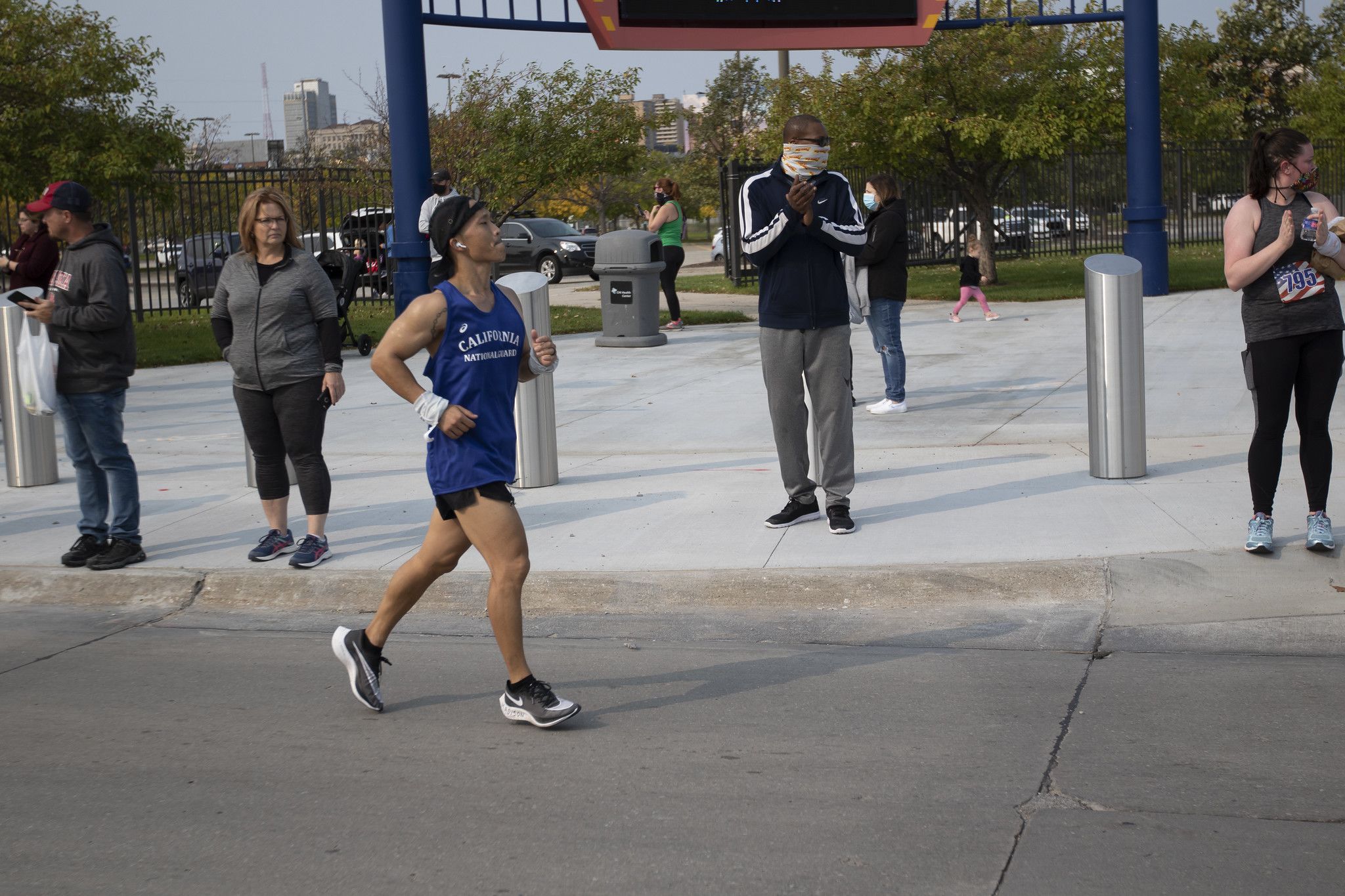 Marathon runner rounds a corner.