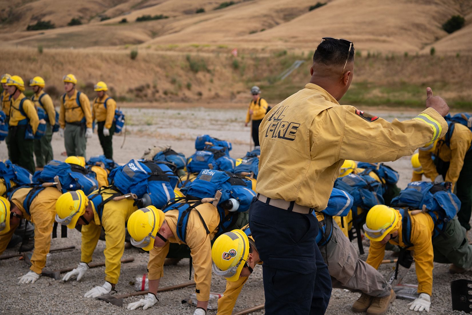 Group of service members do push ups