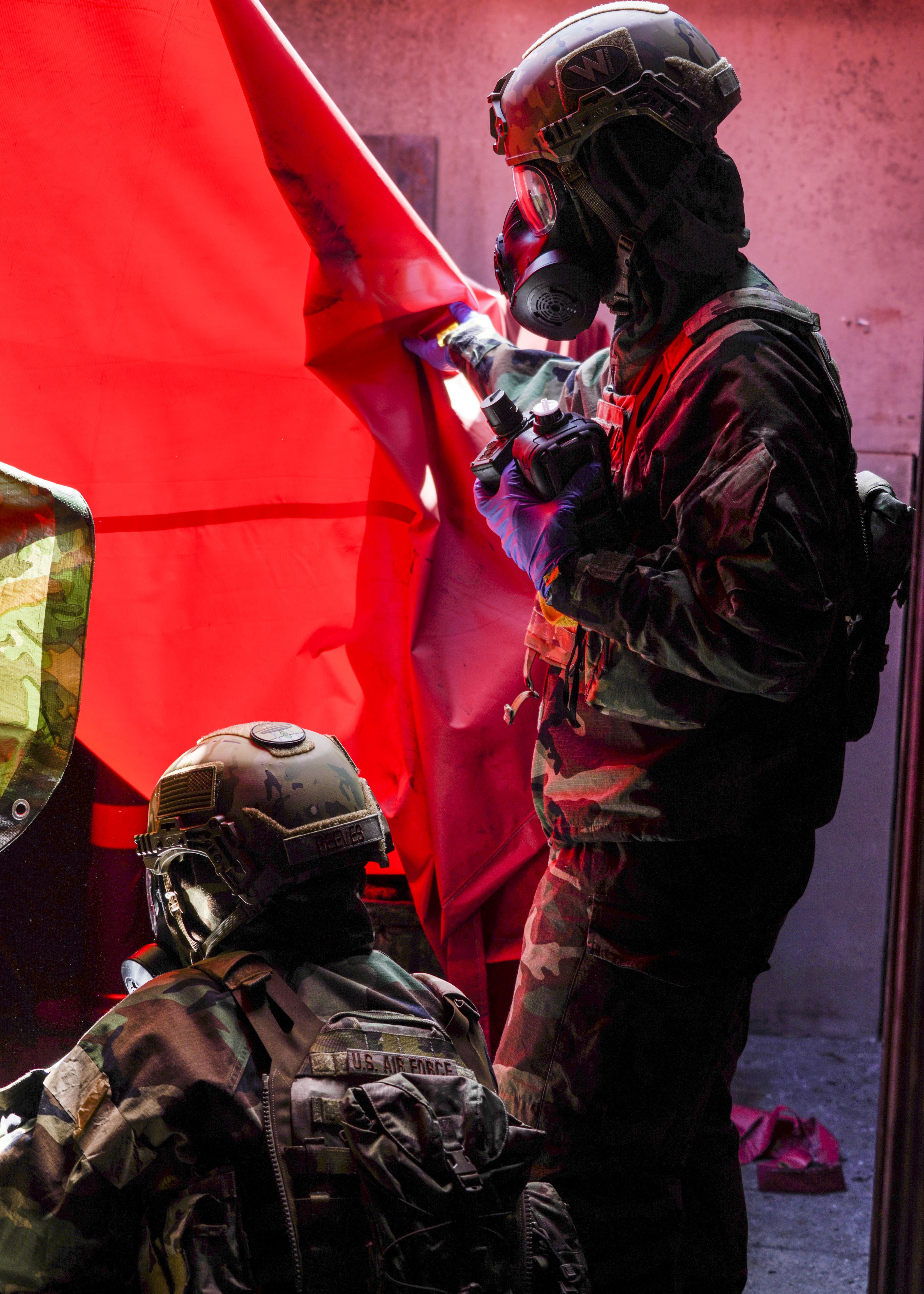 Airmen in chemical gear 