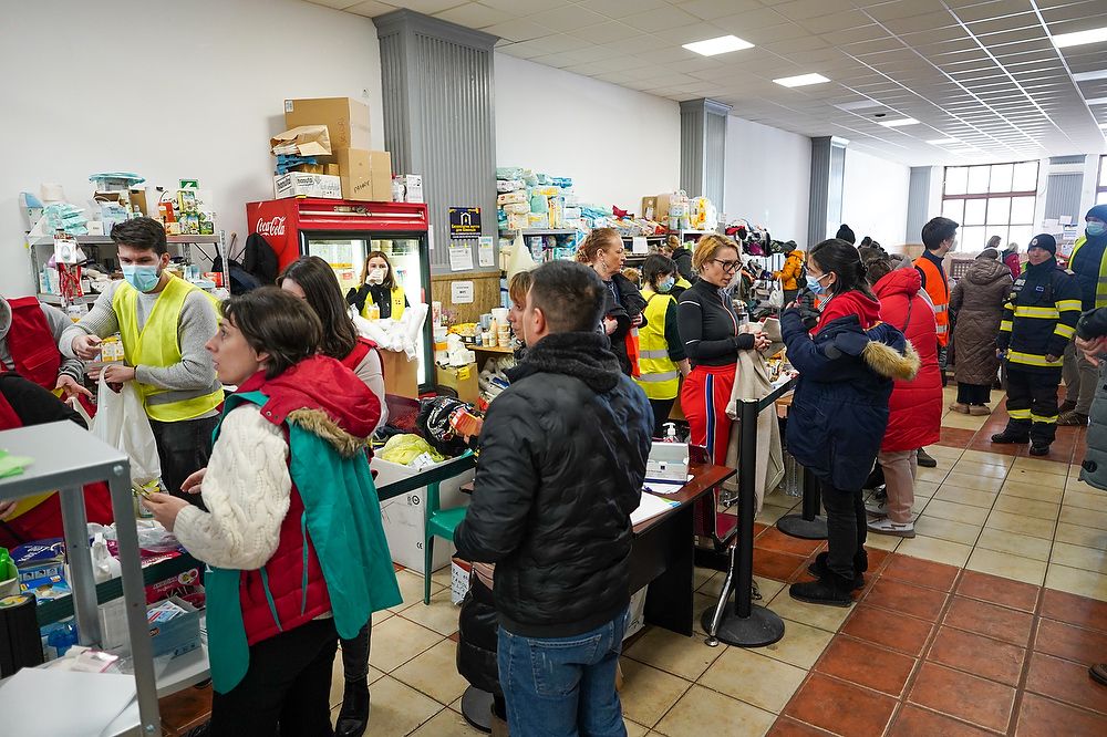 People in a room of supplies.