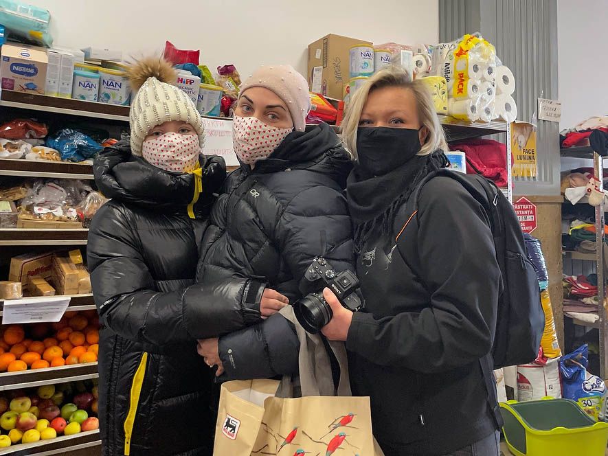 Three females in black jackets.