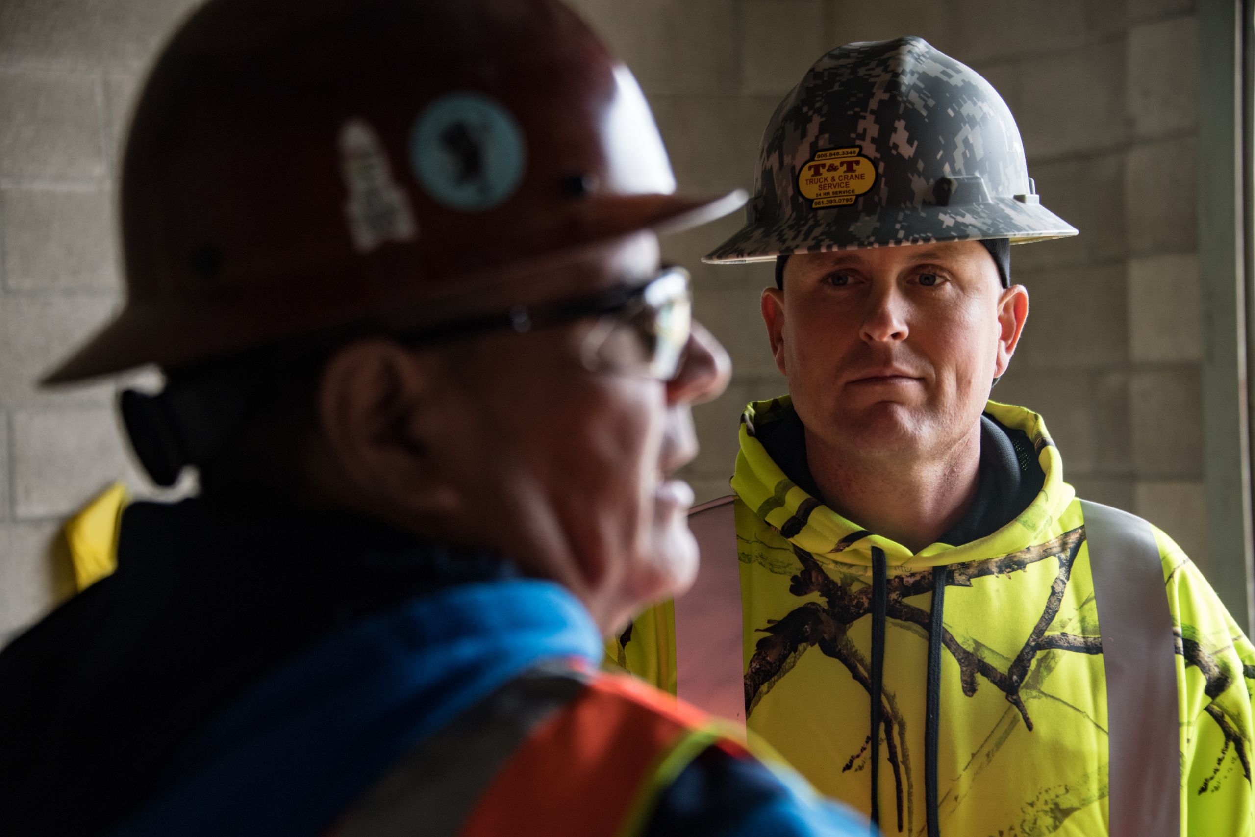 California Air National Guard Senior Airman Todd Senff from the 146th Civil Engineers Squadron (146 CES) discusses construction project updates with a contractor at the Channel Islands Air National Guard Station, Port Hueneme, California December 23, 2019. Senff a project manager for the 146 CES is responsible for ensuring all of the bases contracted service projects provided from outside vendors are up to U.S. Air Force standards. (U.S. Air National Guard photo by: Tech. Sgt. Nieko Carzis.)