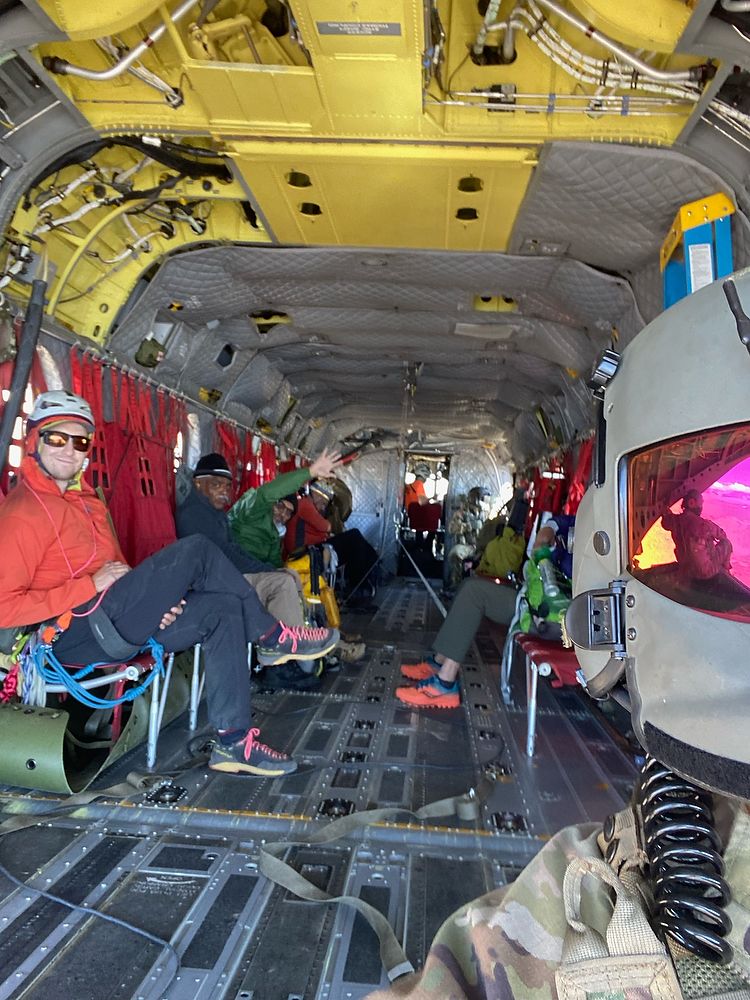 Hikers inside a helicopter.