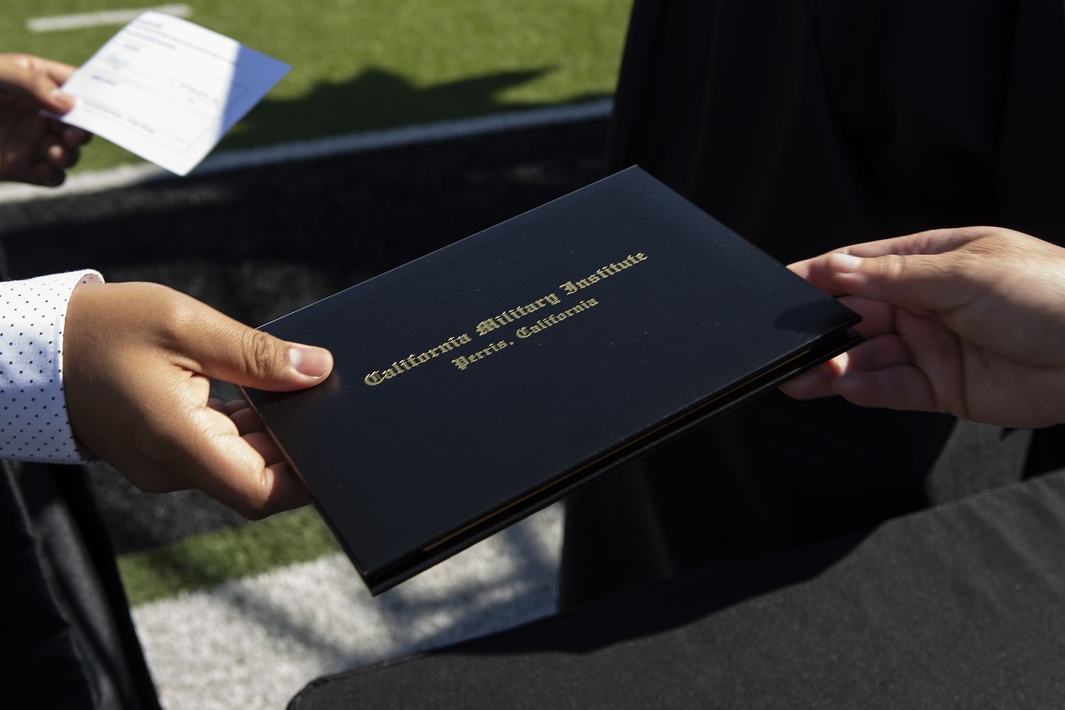 Black diploma cover.