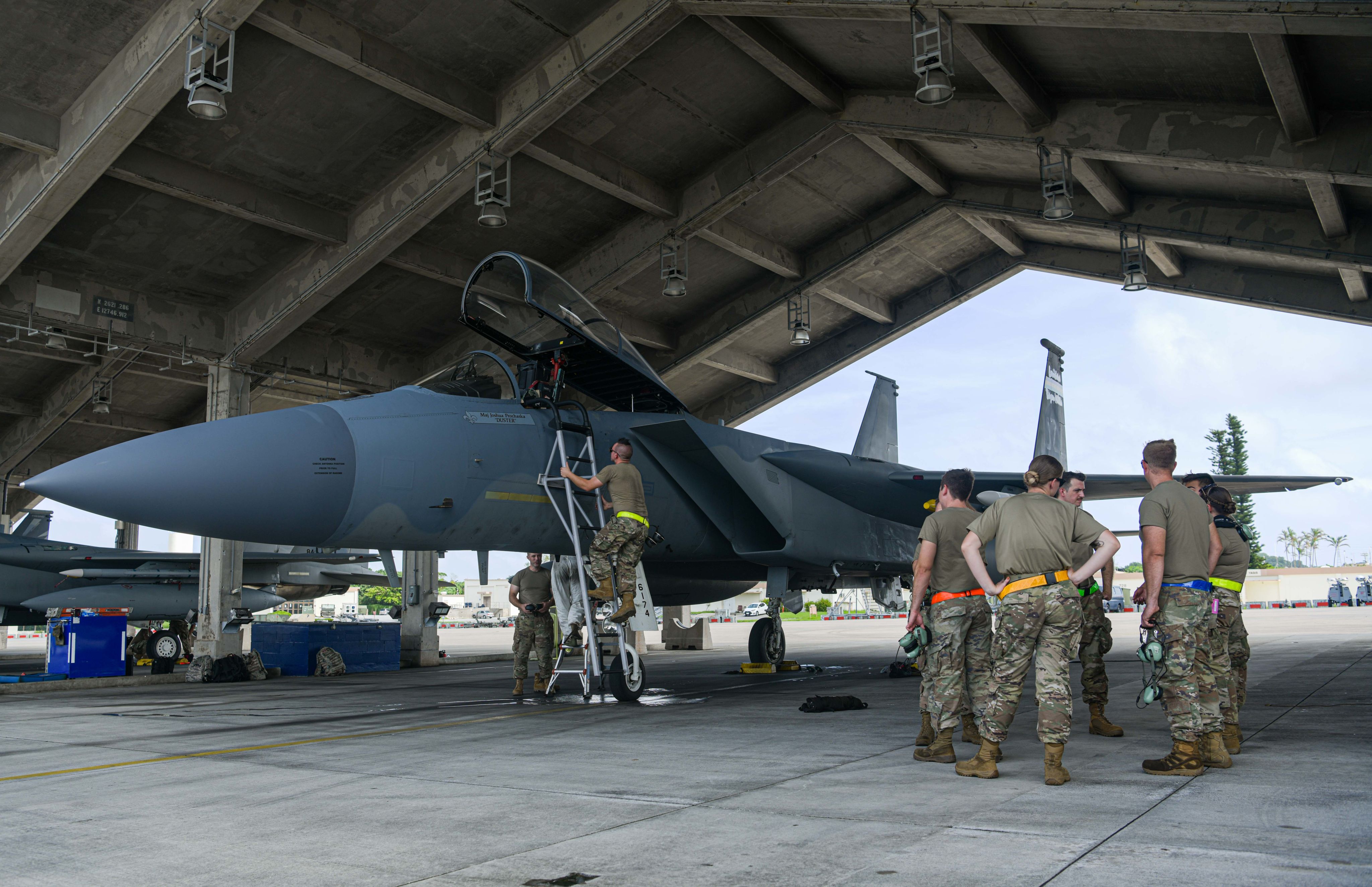 Airmen work on F-16