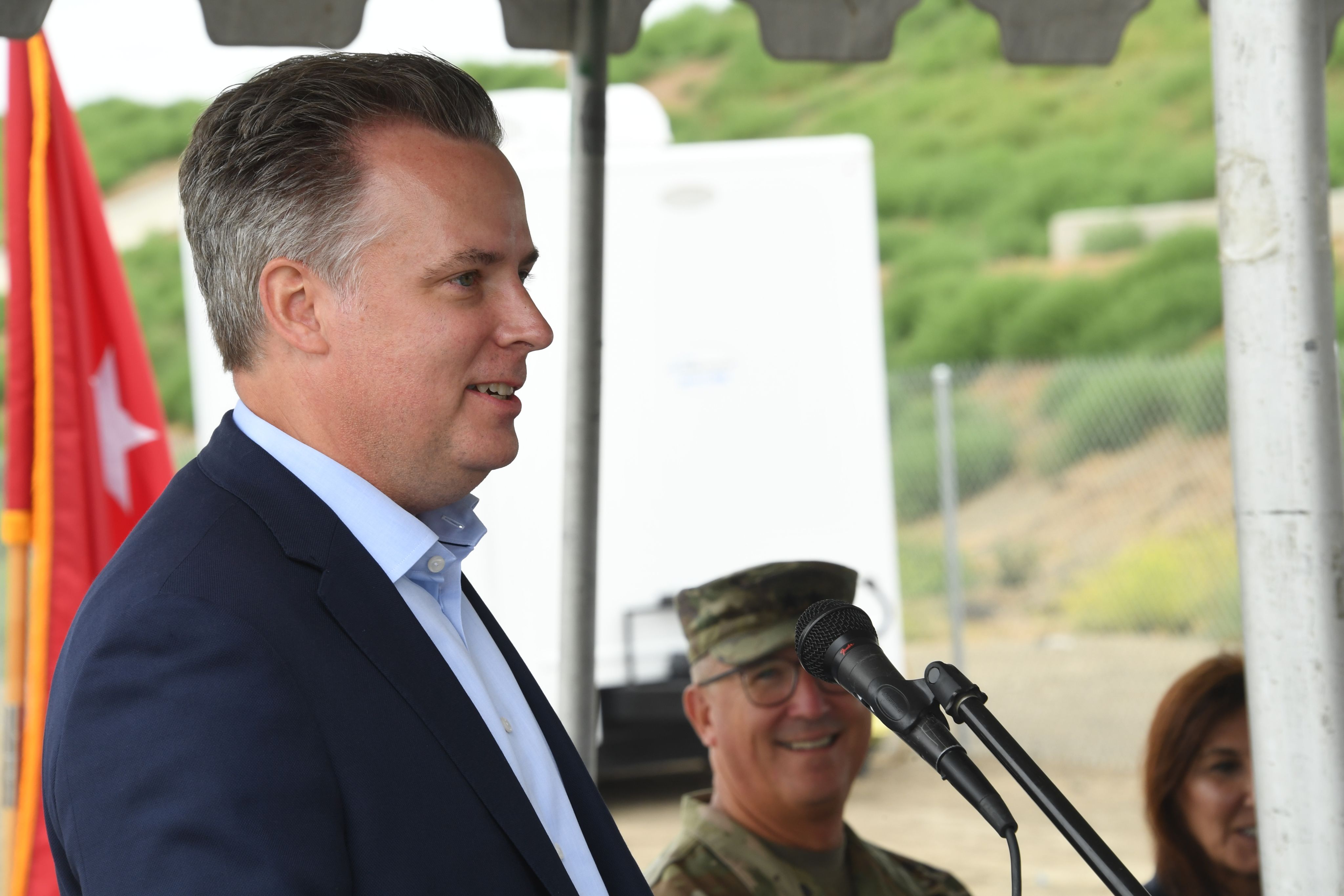 Man delivers speech at podium