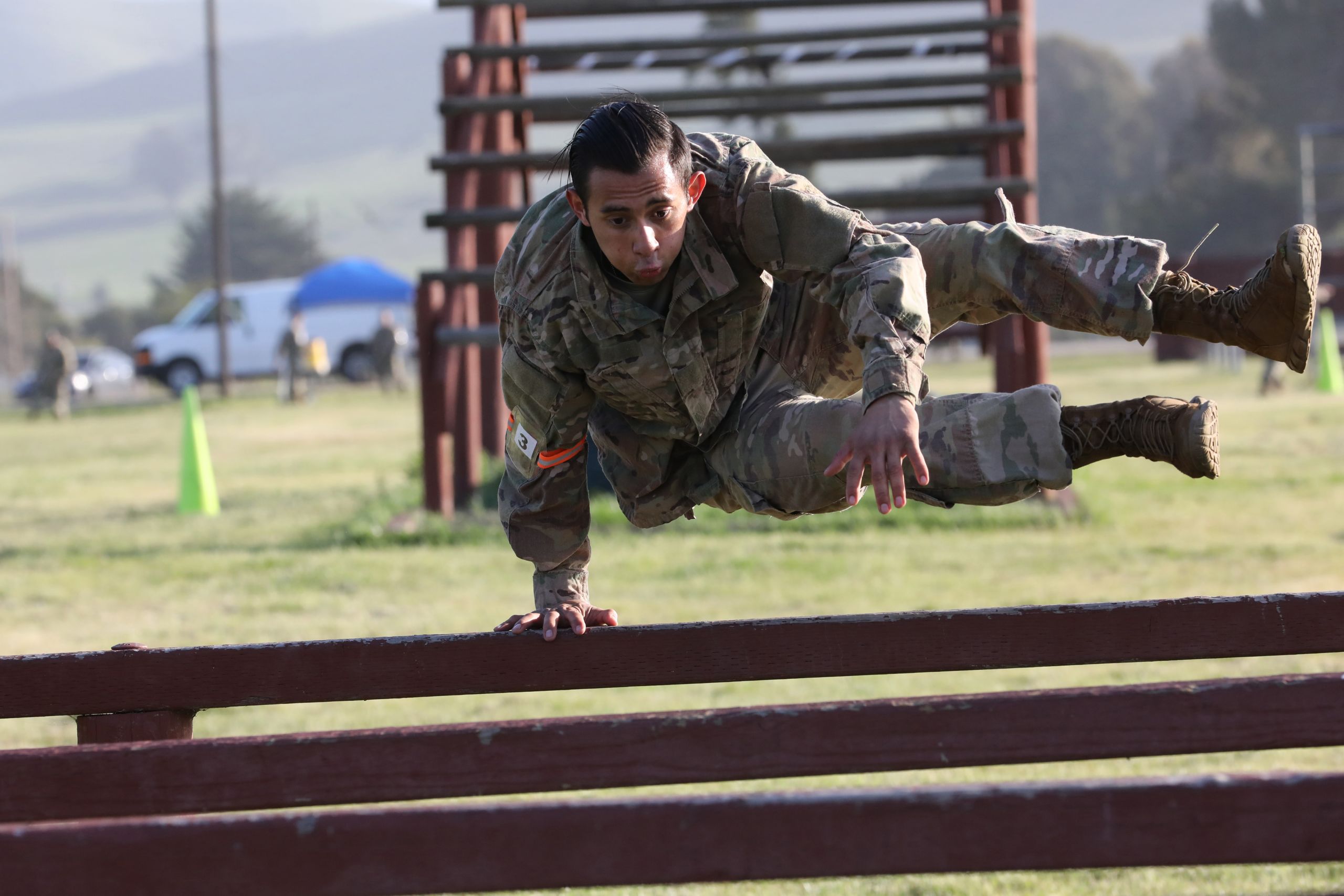 Photo of Cal Guardsman jumping over an obstacle