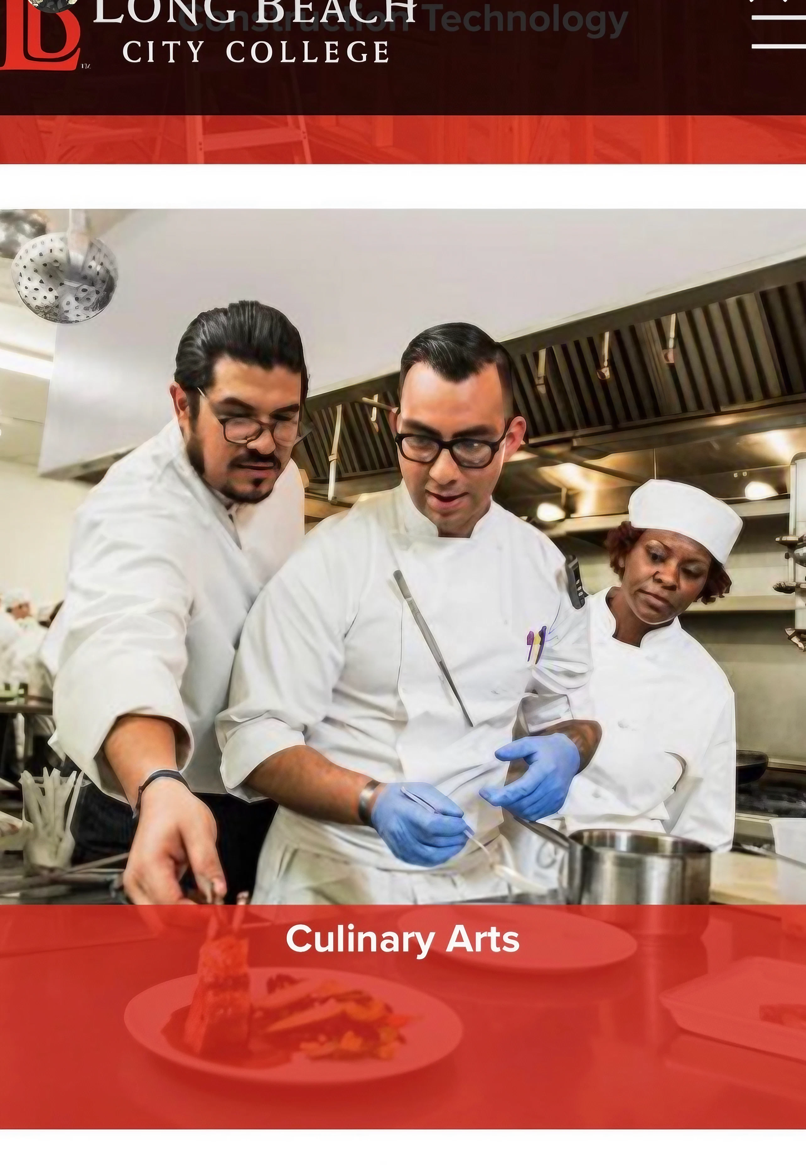 three chefs stand together in kitchen