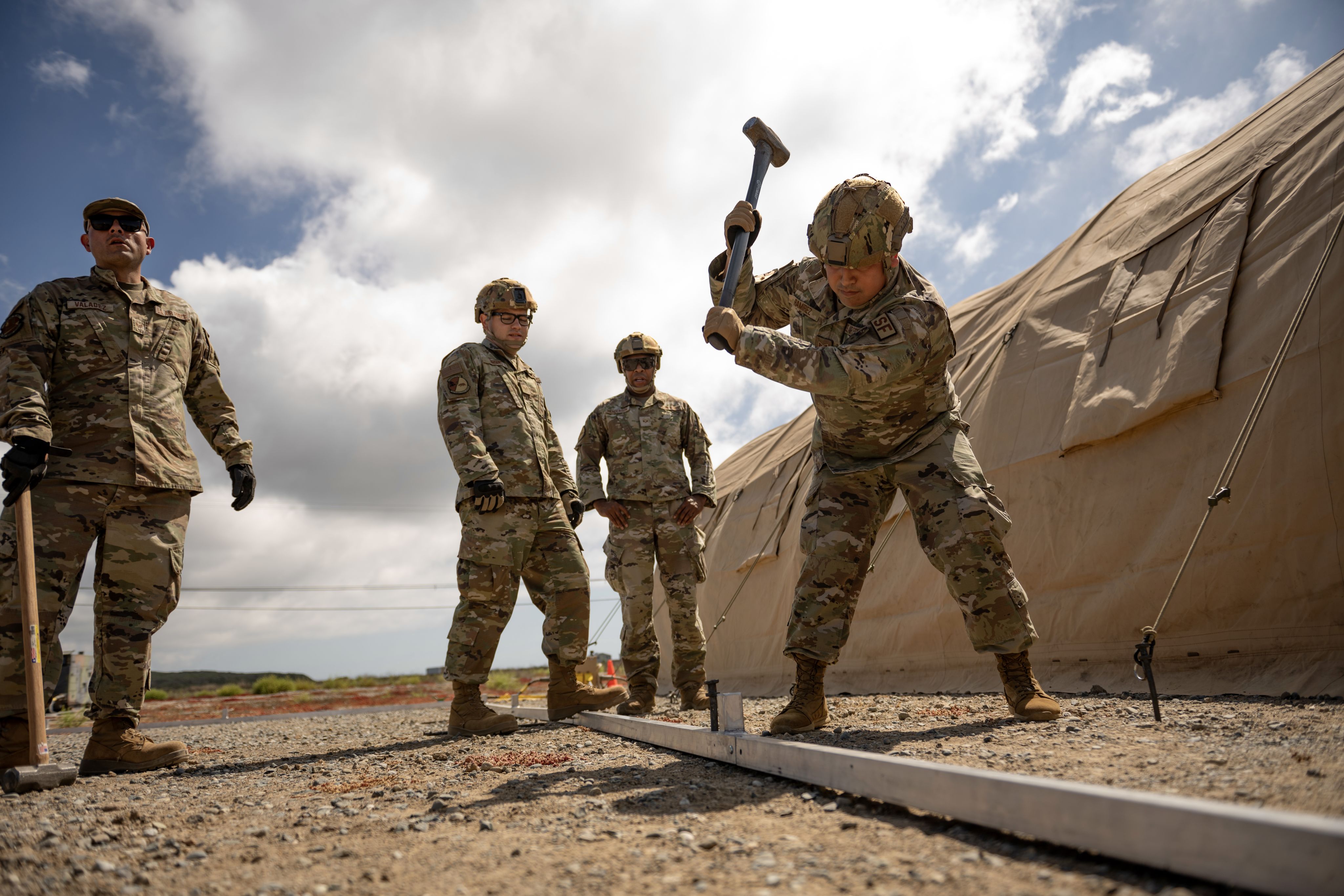 Airmen build tents