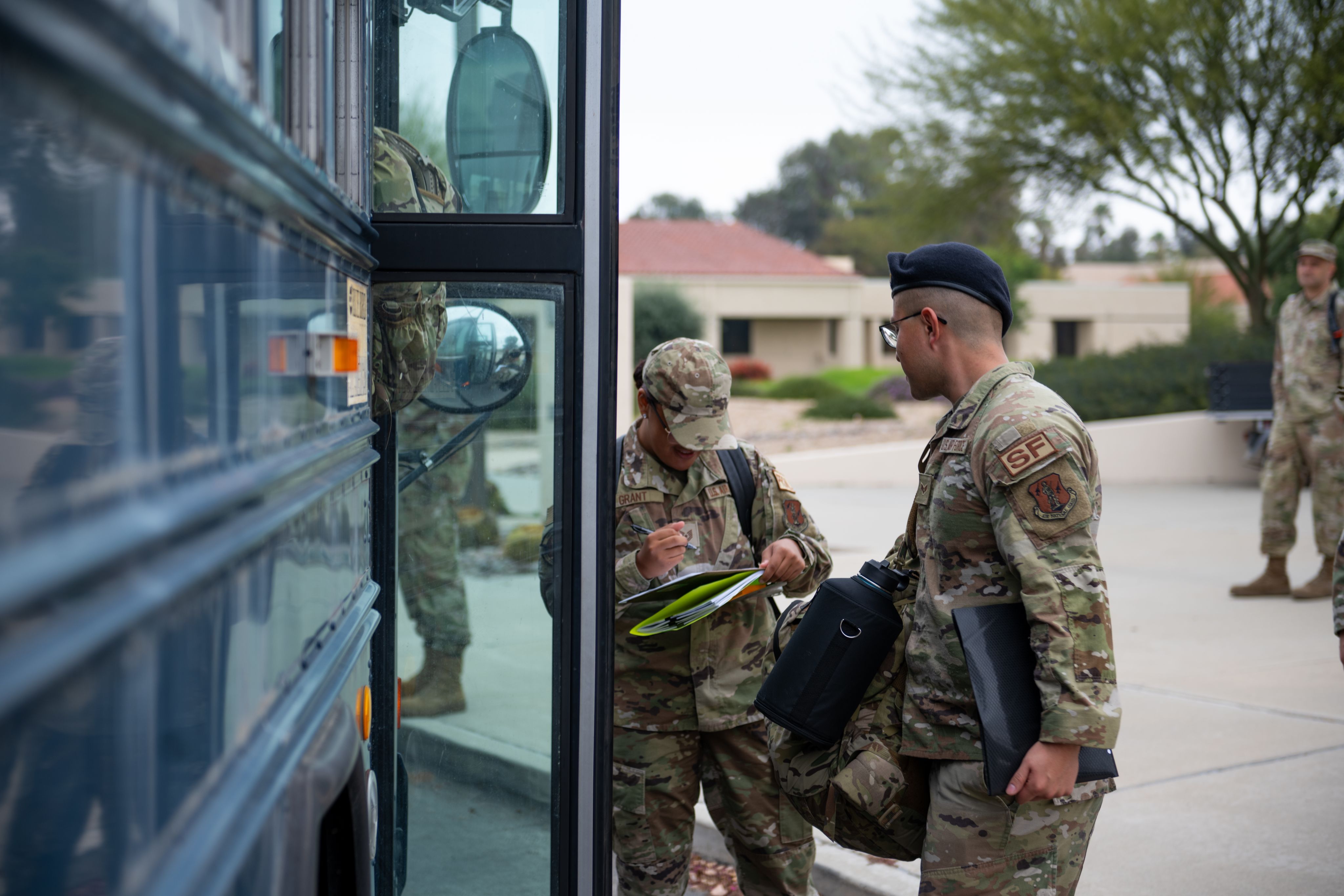 Airmen board a bus