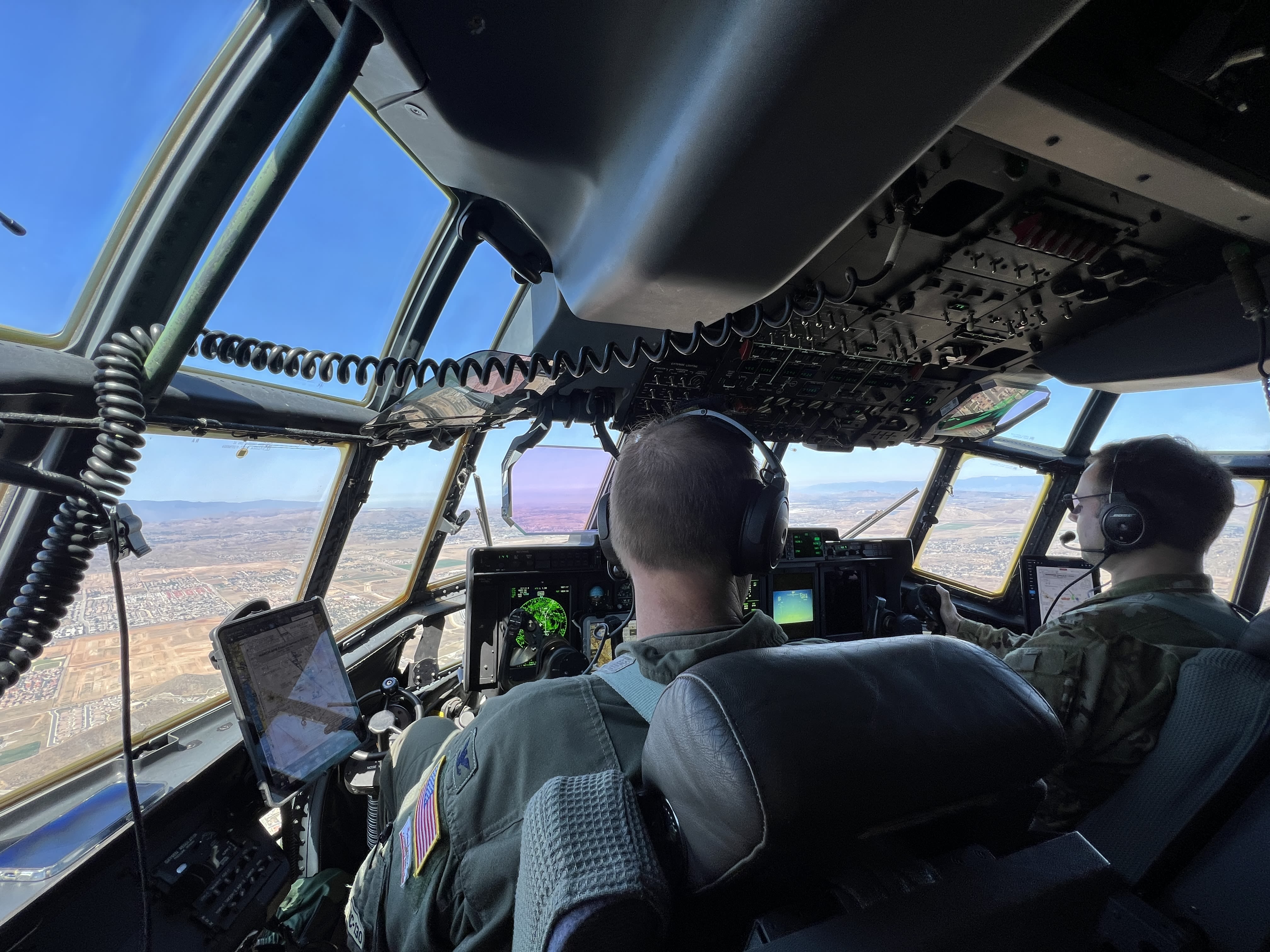 Airmen in cockpit of aircraft