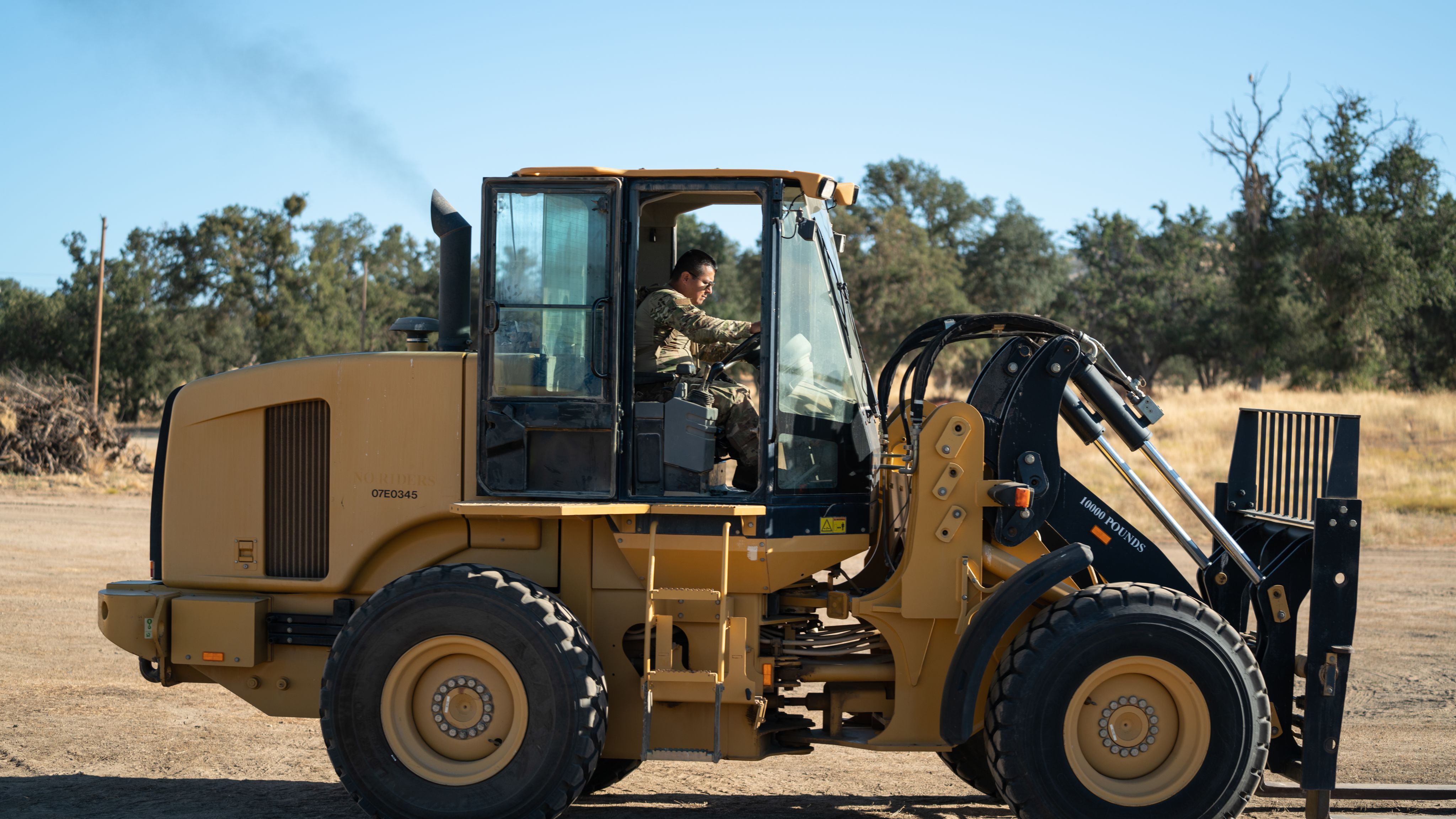 A forklift transports pallets