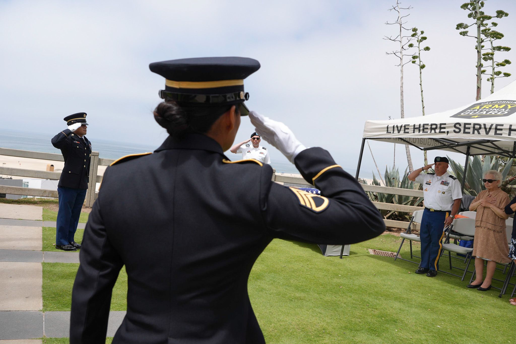 Service members salute