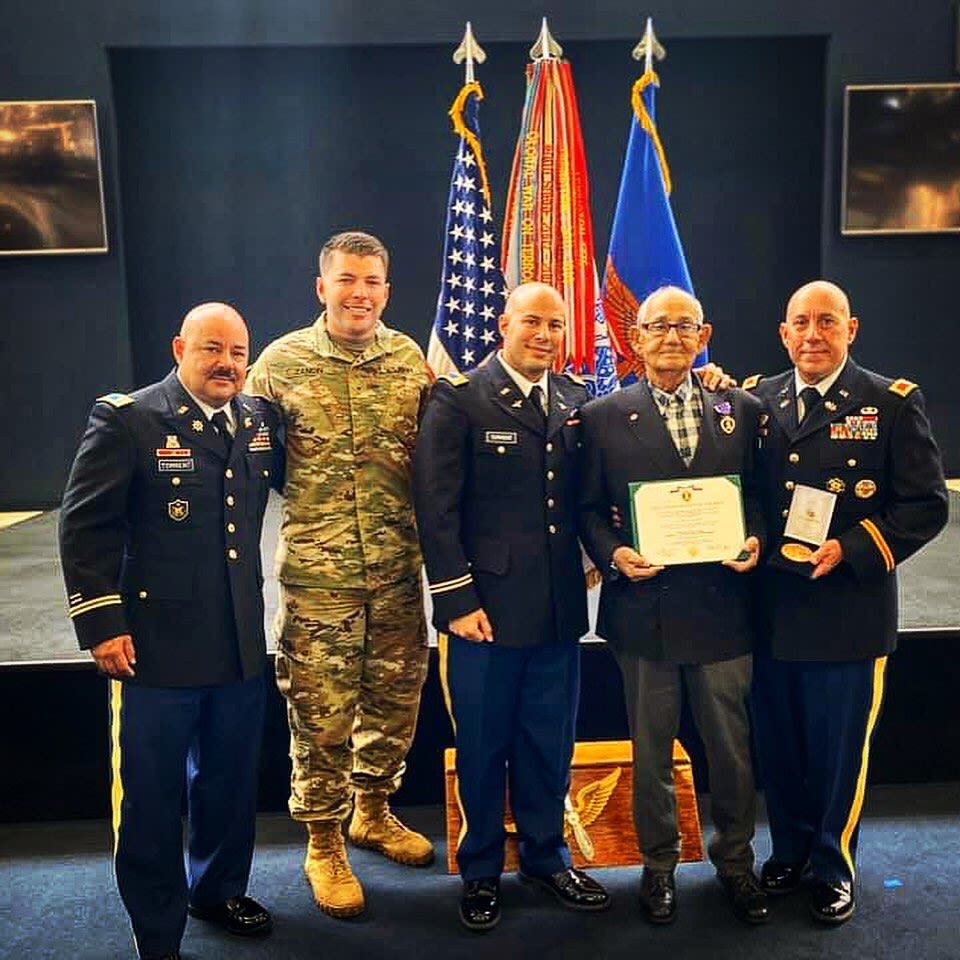 Service members pose for a group photo