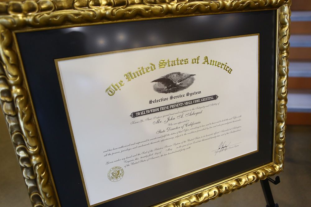 Certificate in gold frame.