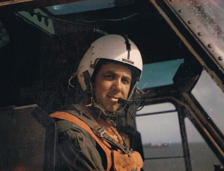 Helicopter pilot in cockpit.