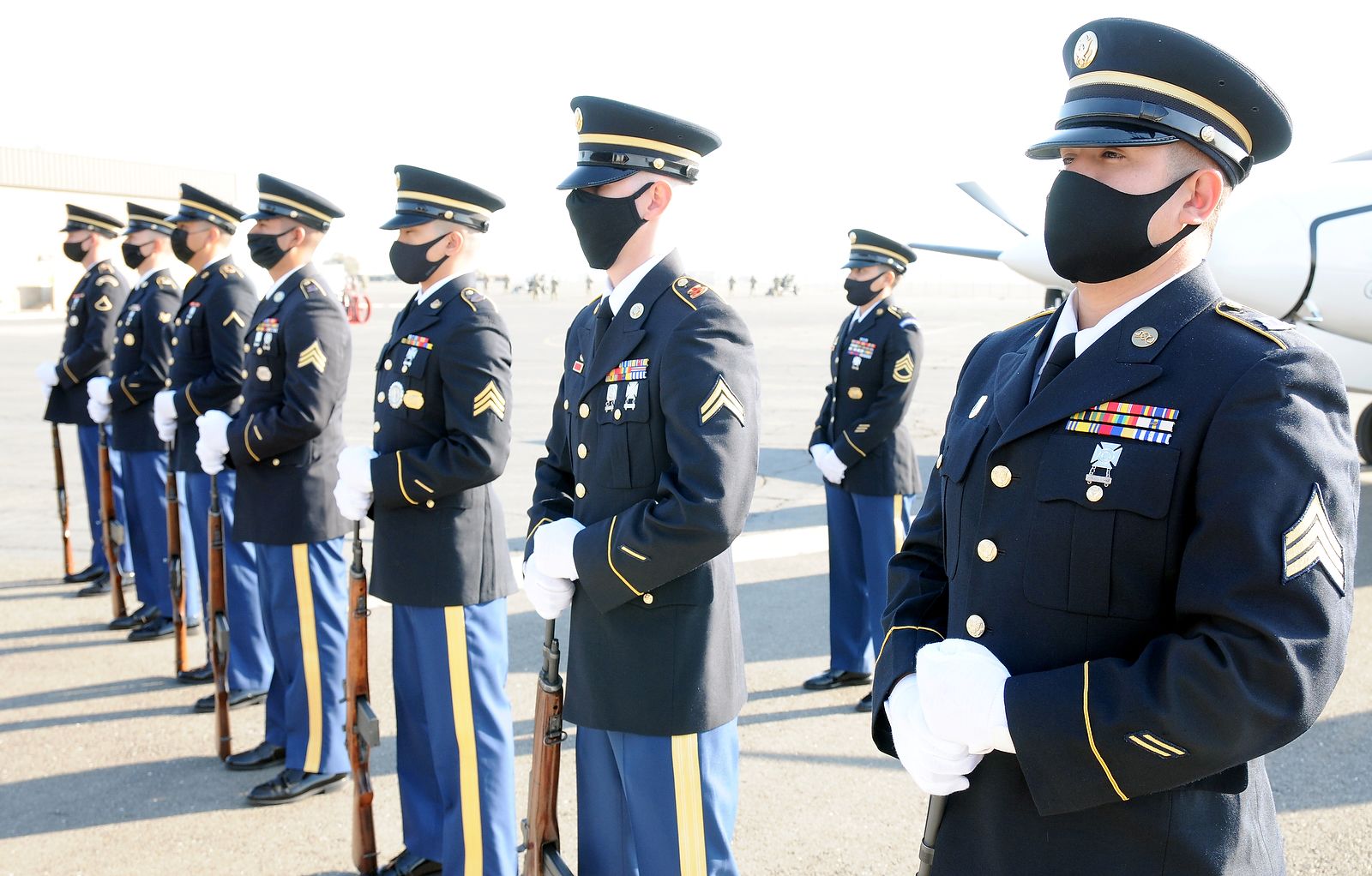 Rifle team stands at ease.