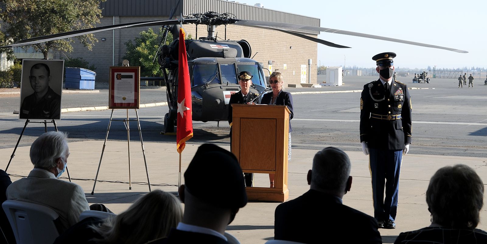 Woman speaks at podium.