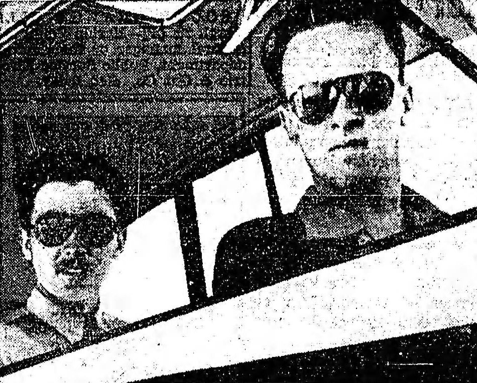 Two men in airplane.