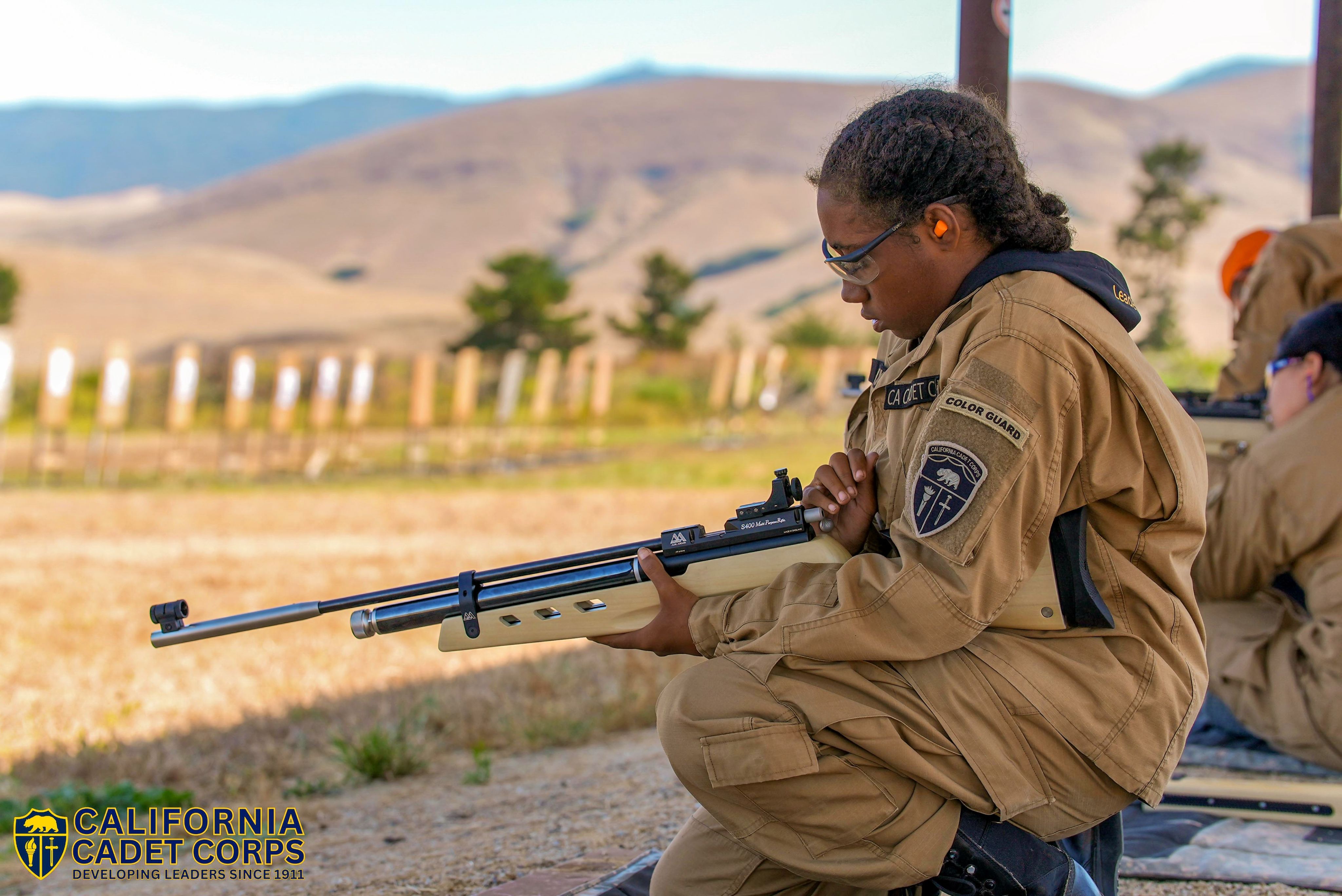 Cadet with CACC Marksmanship program with air rifle on the range.