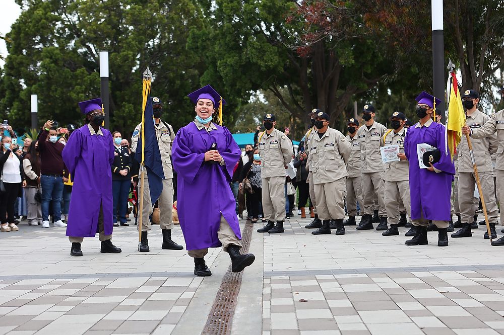 Graduate talks to formation of cadets.