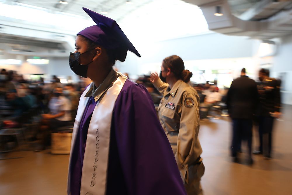 Teen in purple cap and gown.