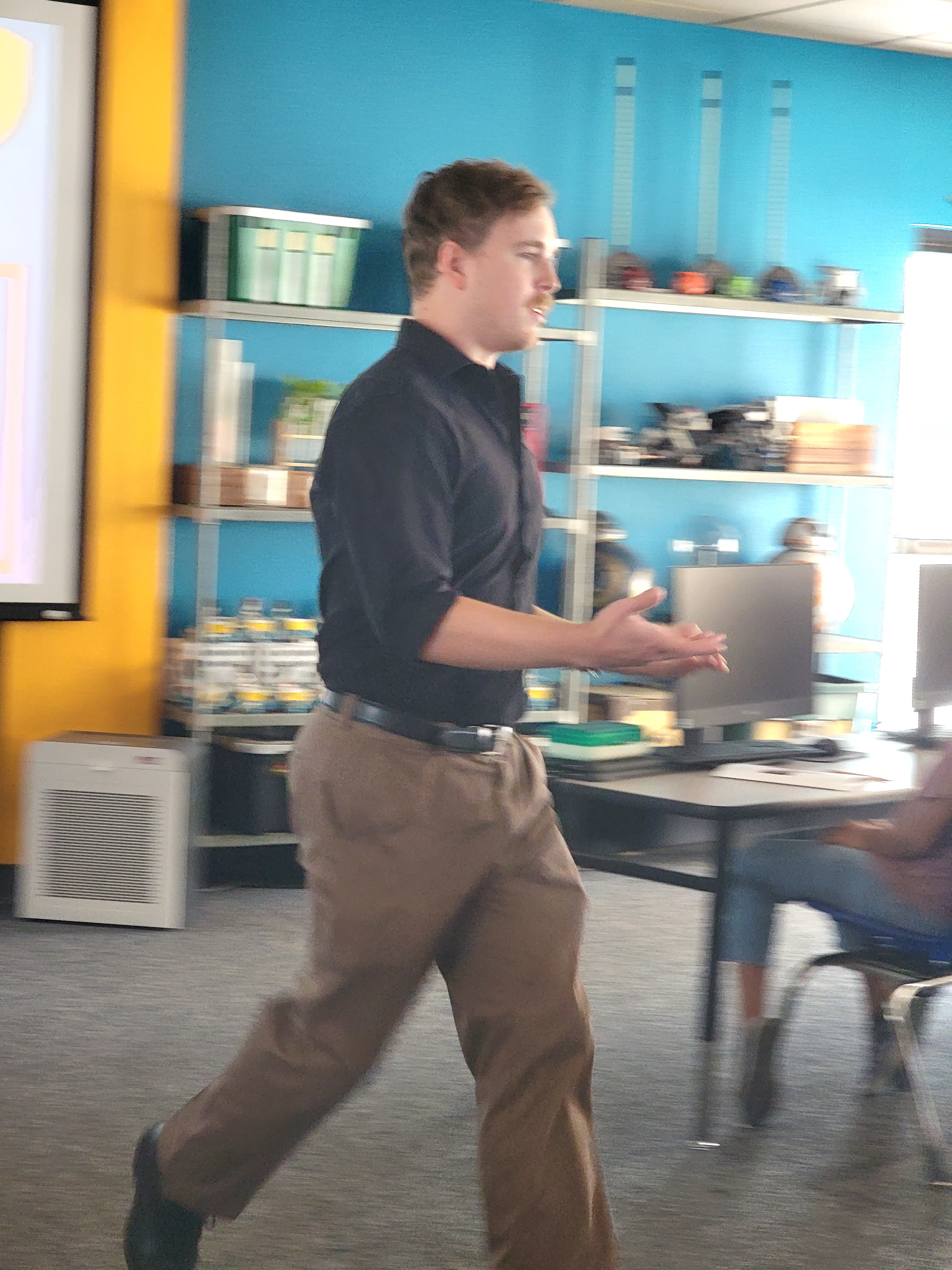 man walks among students