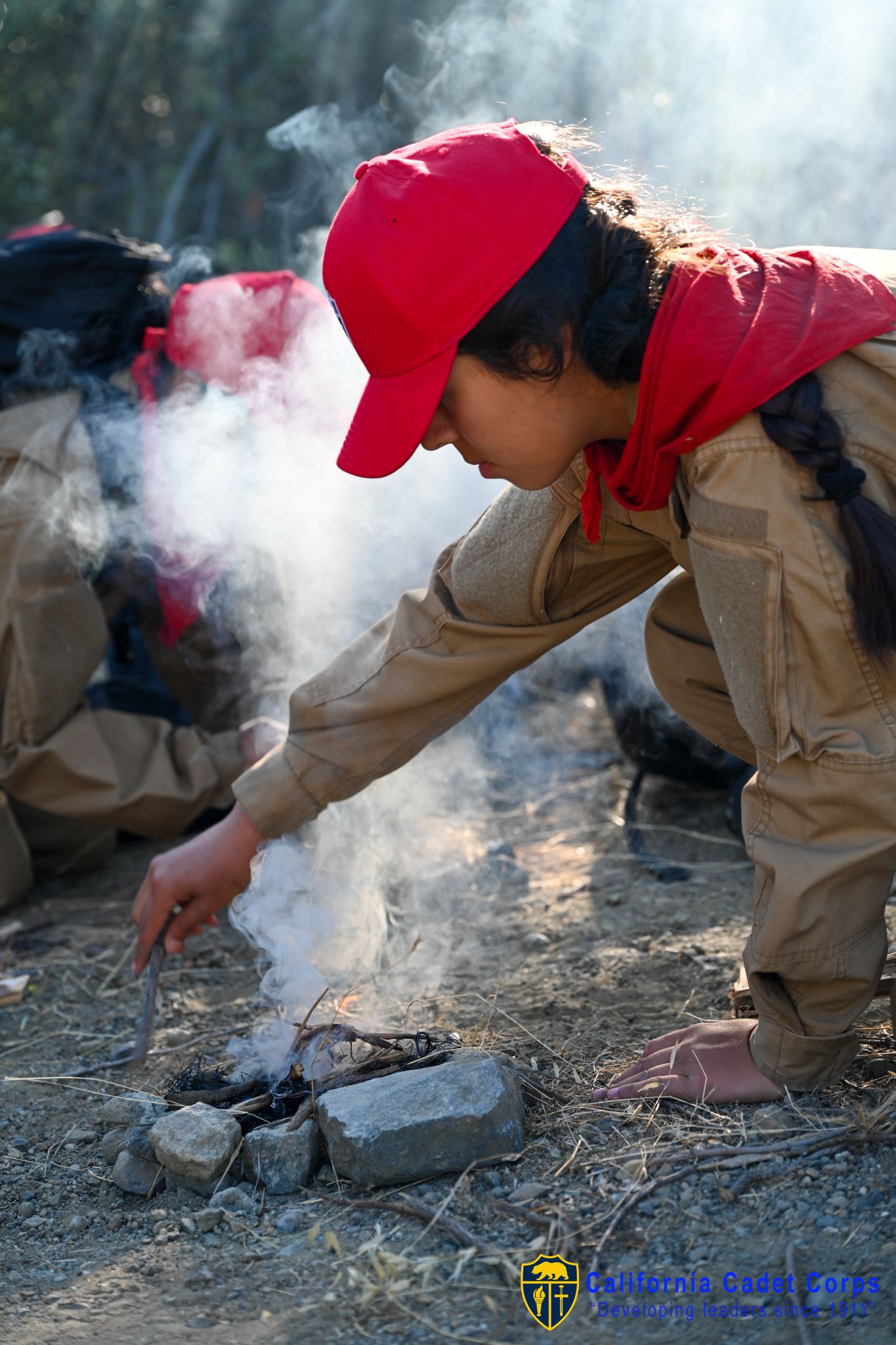 Cadet with CACC Survival program learns to make a fire.