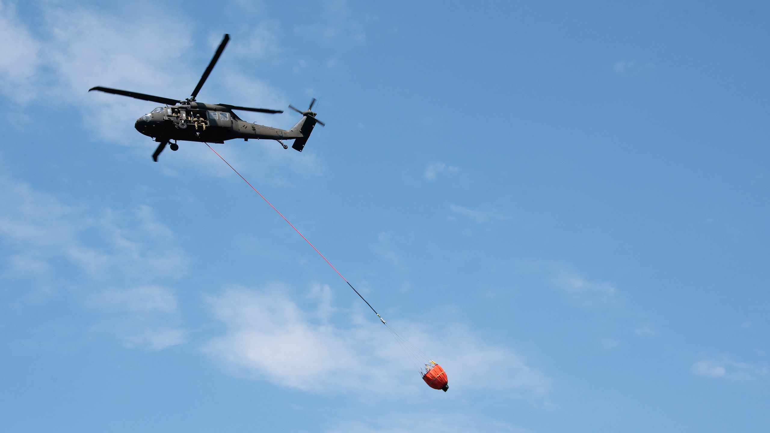 Helicopter with water bucket.