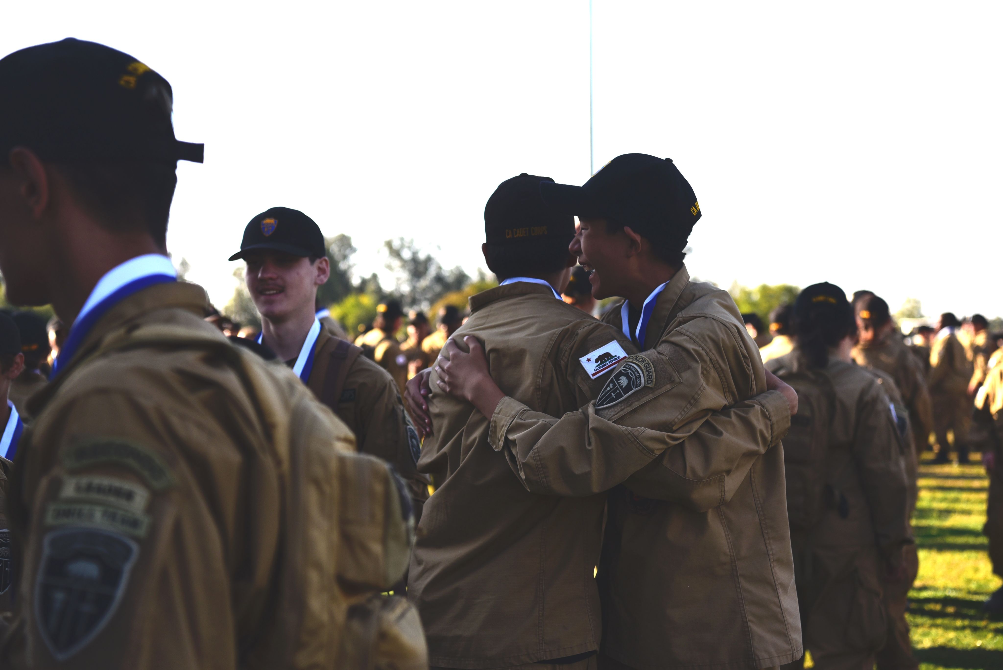 Two cadets hug.