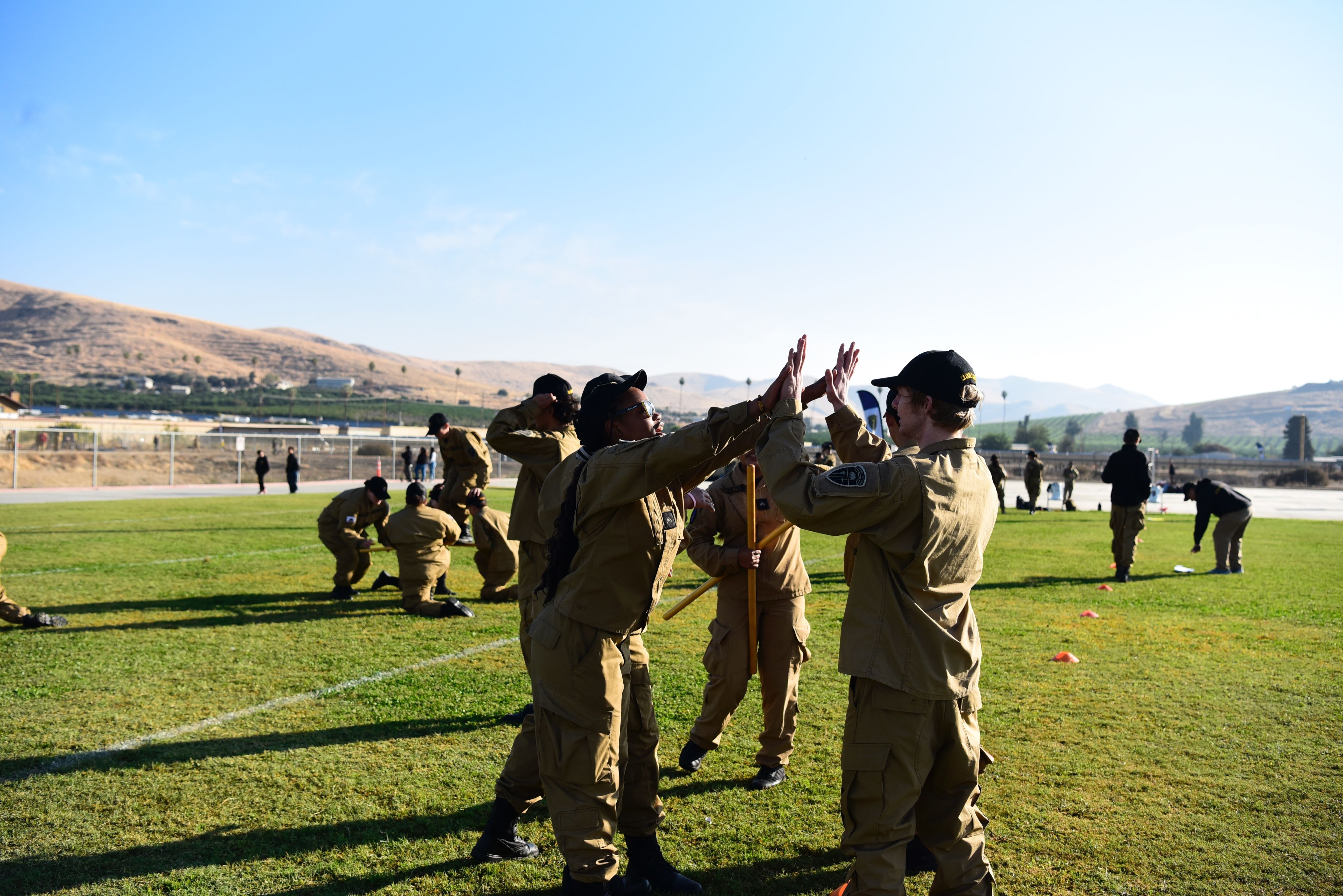 Two Cadets high five.
