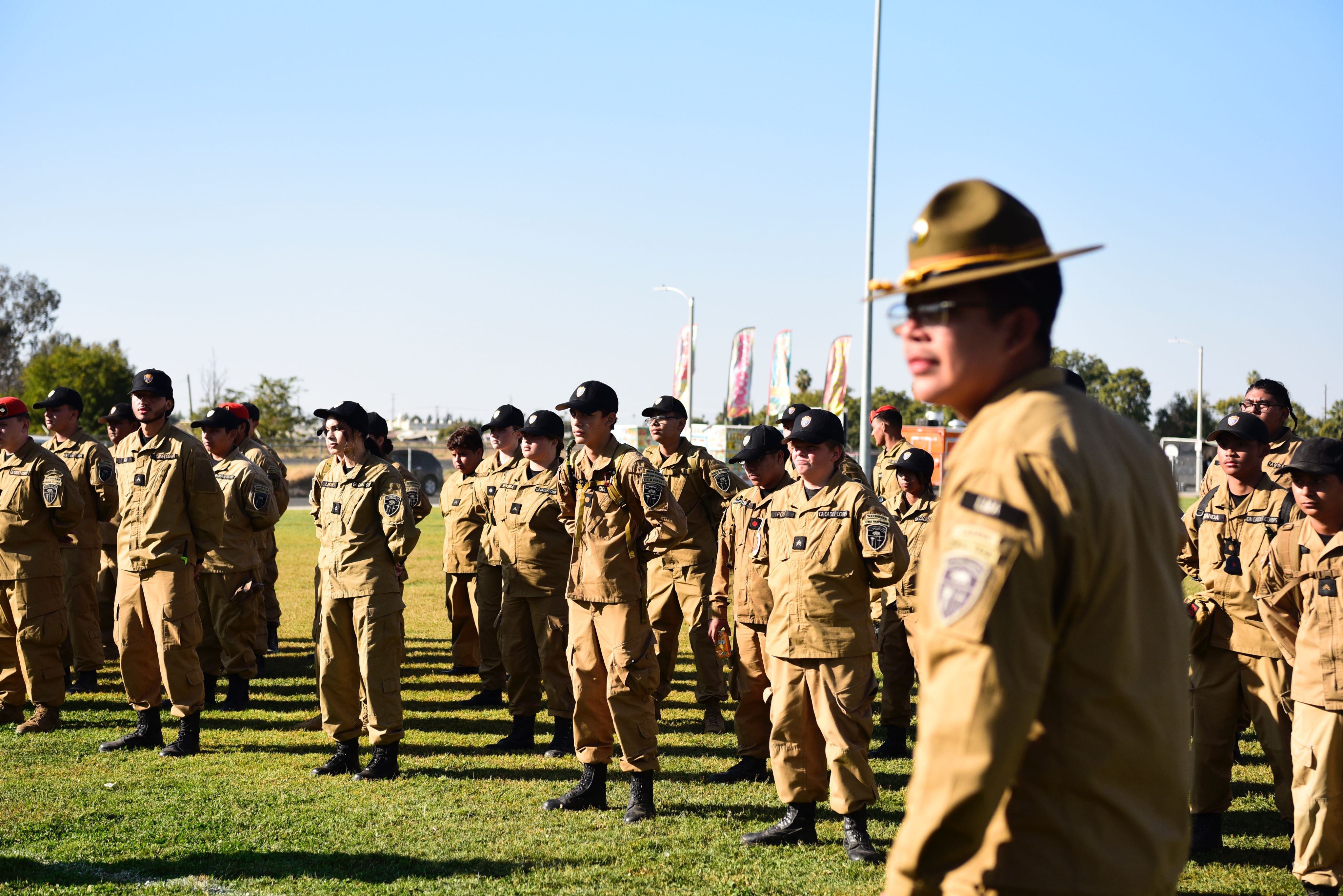 A group of cadets stand in formation.
